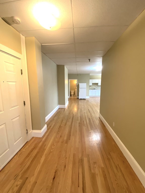 11 Lawrence Street, Unit 606 Lawrence, MA 01840 - Photo 2 of 10 a view of a hallway with wooden floor