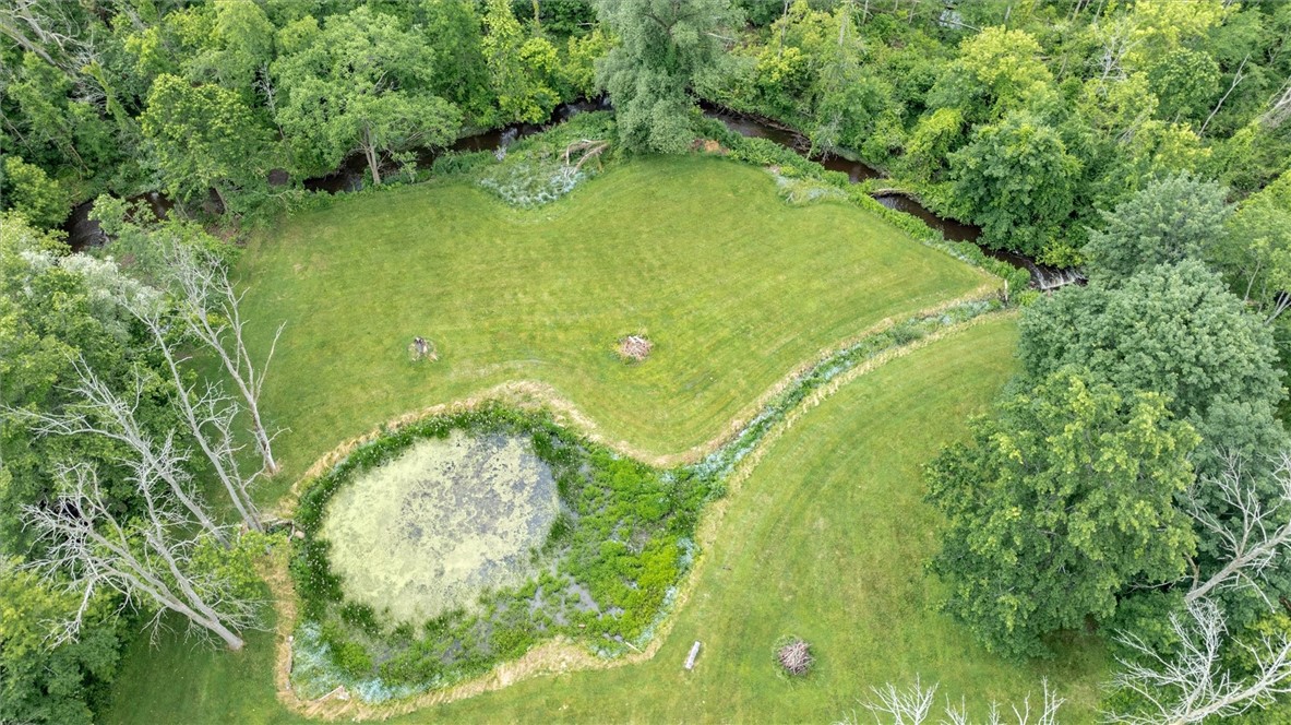 4805 West Ridge Road Parma, NY 14559 - Photo 18 of 50 Pond fed by creek that runs through the property