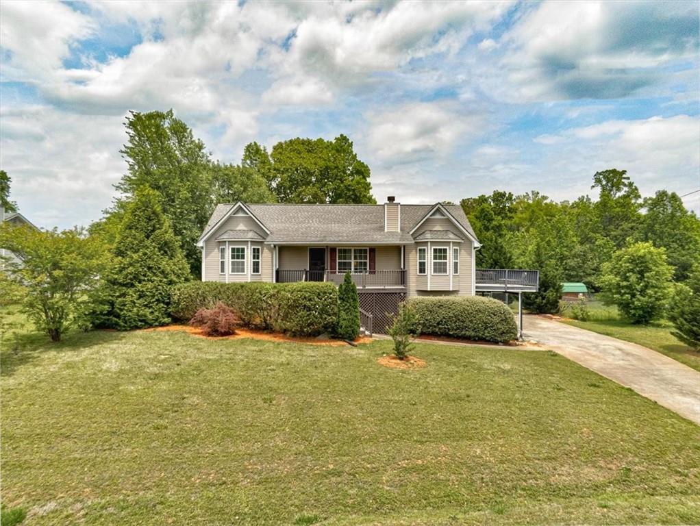 a front view of a house with a yard