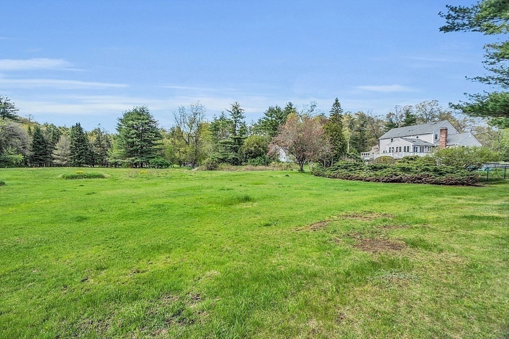 1 Chester Road Boxborough, MA 01719 - Photo 12 of 41 a view of a big yard with a building in the background