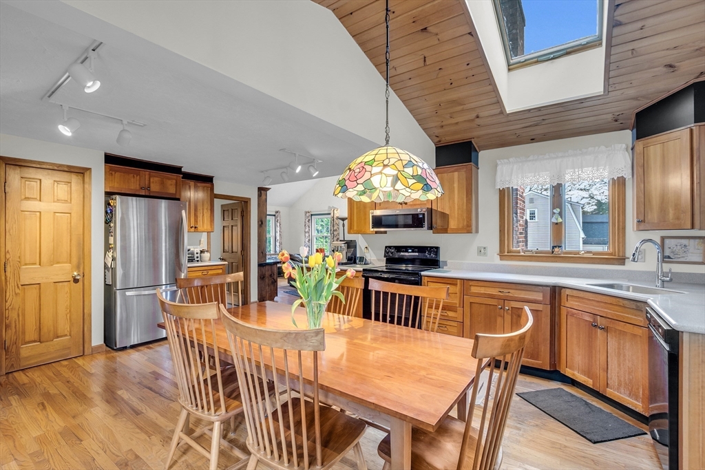 1 Chester Road Boxborough, MA 01719 - Photo 20 of 41 a view of a dining room with furniture a chandelier and wooden floor