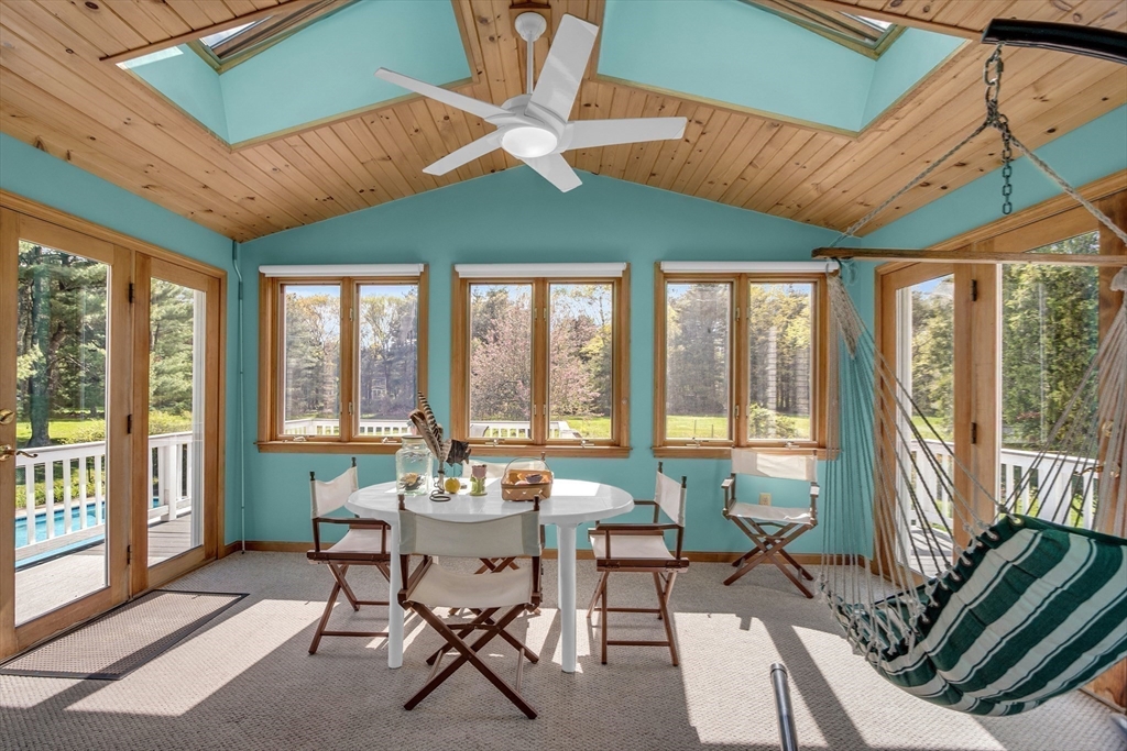 1 Chester Road Boxborough, MA 01719 - Photo 22 of 41 a dining room with furniture large windows and a chandelier