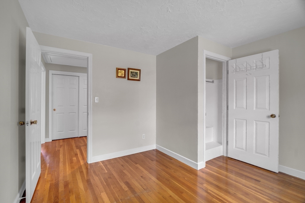 1 Chester Road Boxborough, MA 01719 - Photo 29 of 41 a view of an empty room with wooden floor