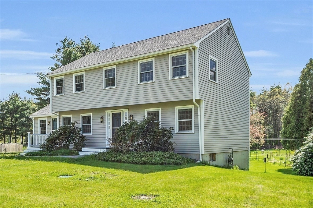 1 Chester Road Boxborough, MA 01719 - Photo 3 of 41 a front view of house with yard and green space