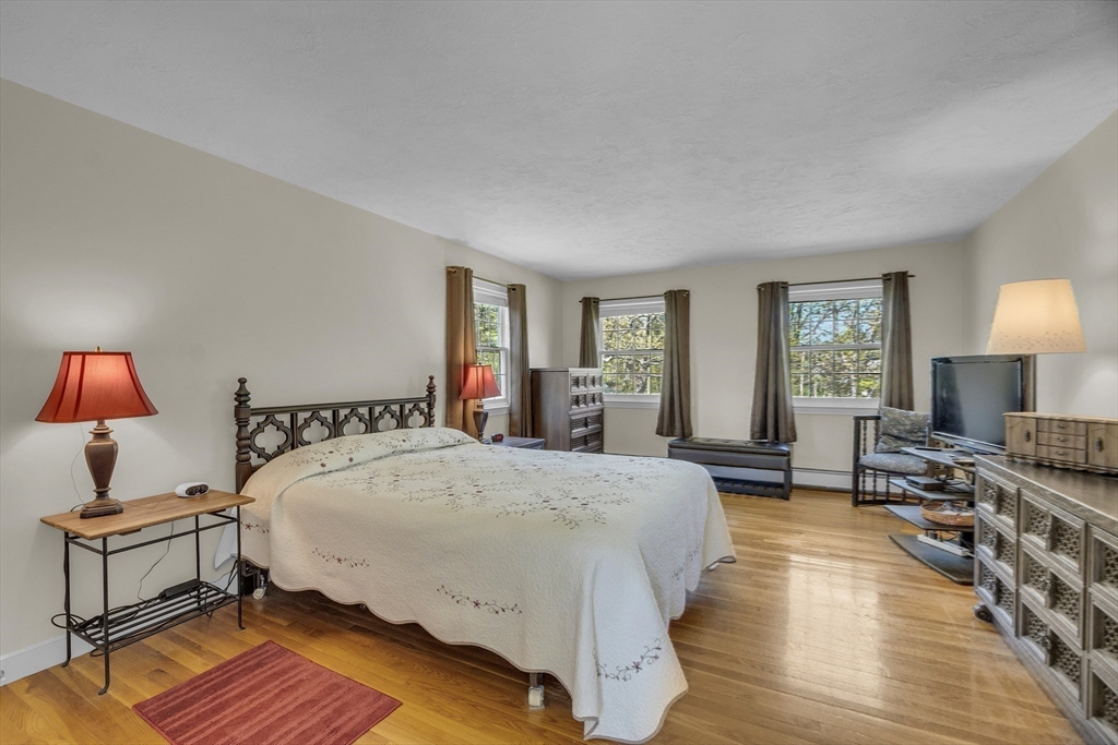 1 Chester Road Boxborough, MA 01719 - Photo 33 of 41 a spacious bedroom with a bed a lamp and window