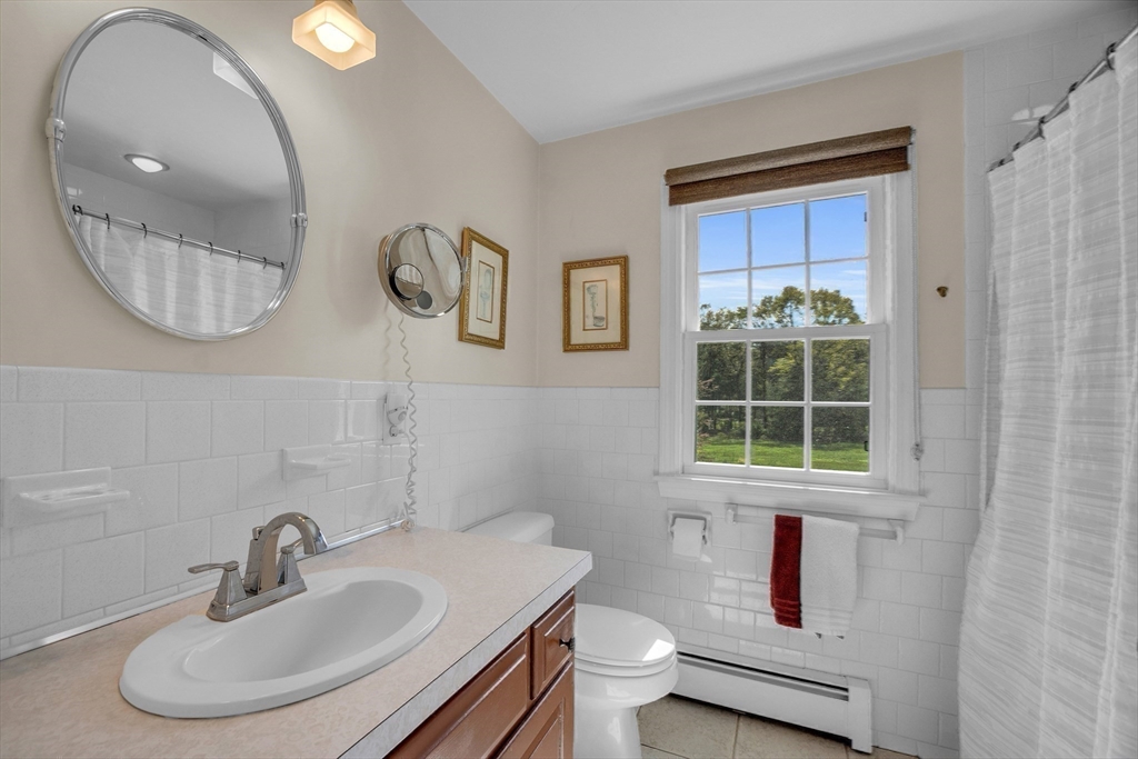 1 Chester Road Boxborough, MA 01719 - Photo 34 of 41 a bathroom with a sink and a mirror