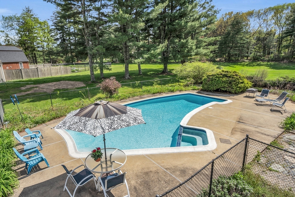1 Chester Road Boxborough, MA 01719 - Photo 4 of 41 a view of a swimming pool and lounge chairs