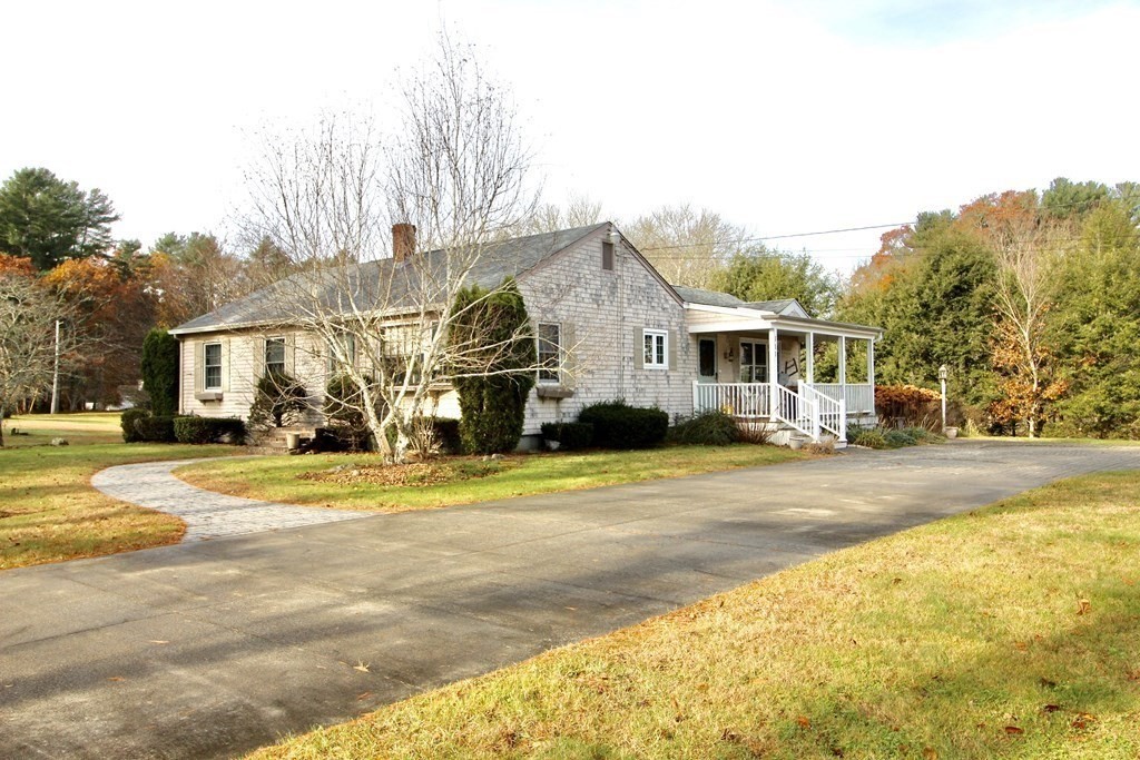 a front view of a house with a swimming pool
