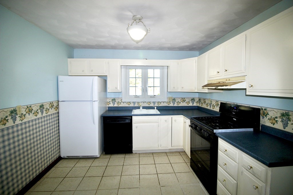 111 County Road East Freetown, MA 02717 - Photo 15 of 29 a kitchen with a refrigerator and a stove top oven