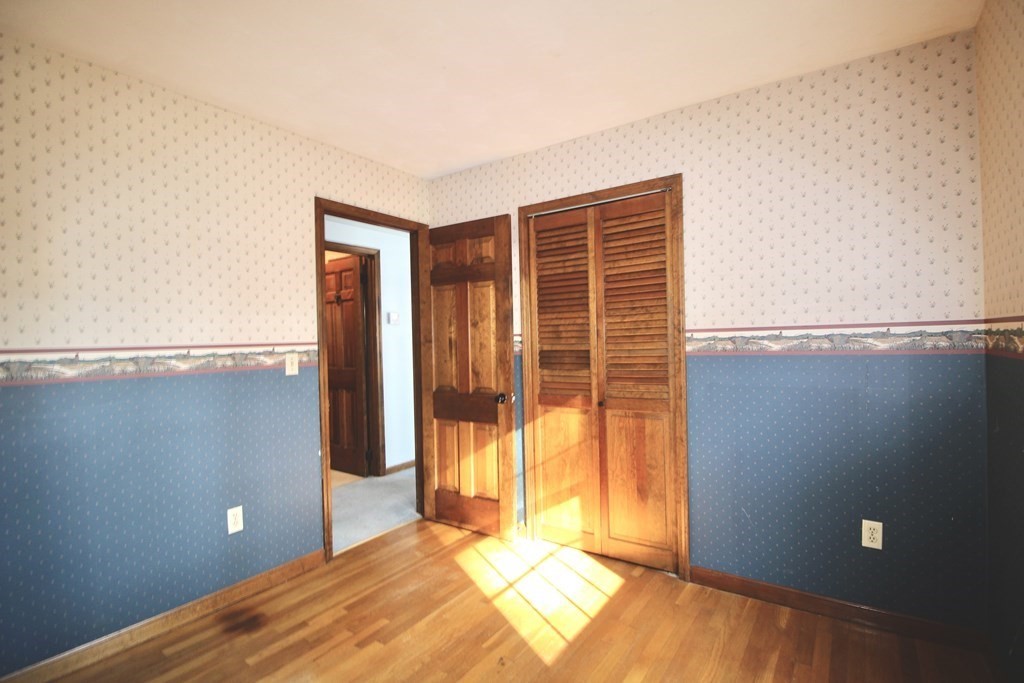 111 County Road East Freetown, MA 02717 - Photo 21 of 29 a view of a bedroom with a large door