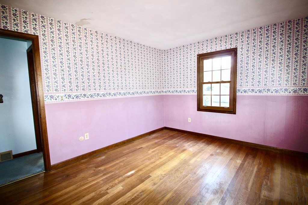 111 County Road East Freetown, MA 02717 - Photo 24 of 29 an empty room with wooden floor and windows