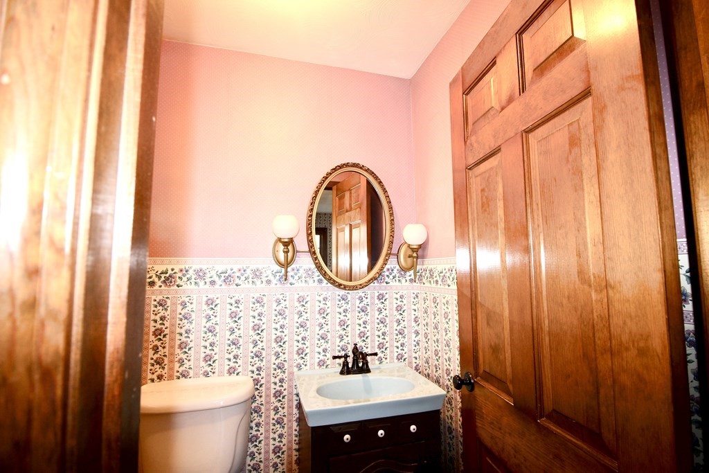 111 County Road East Freetown, MA 02717 - Photo 27 of 29 a bathroom with a sink a toilet and a mirror