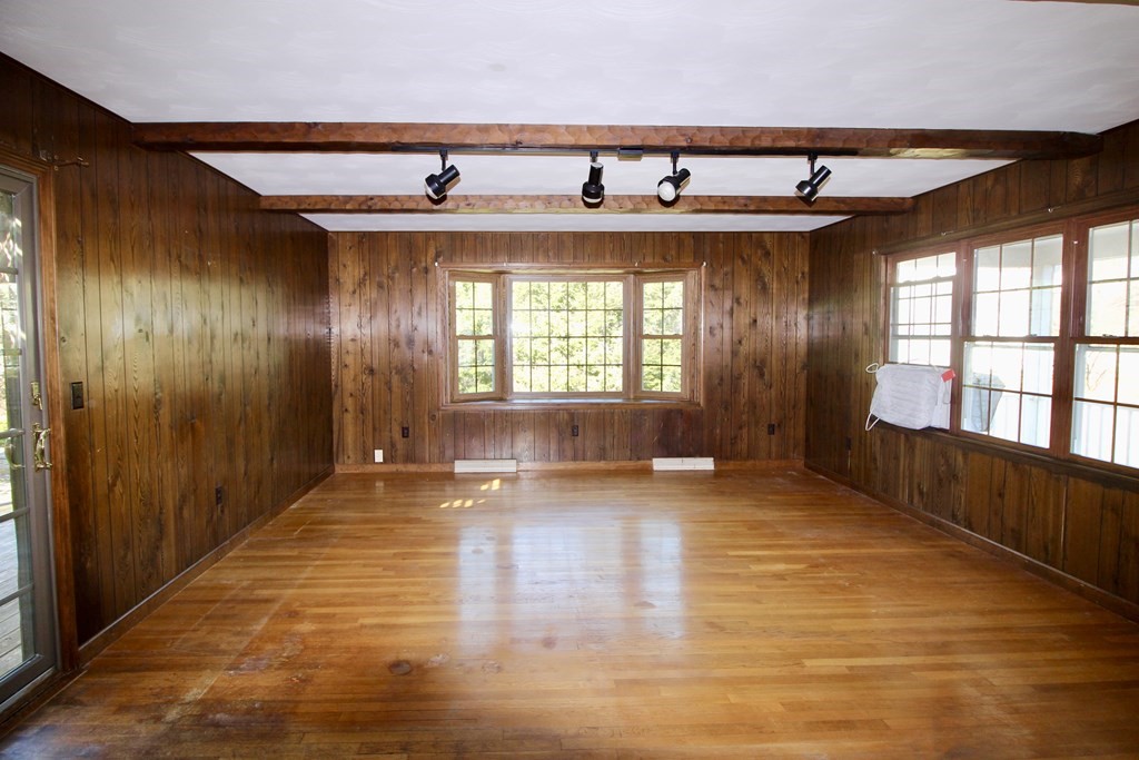 111 County Road East Freetown, MA 02717 - Photo 10 of 29 a view of an empty room with wooden floor and a window