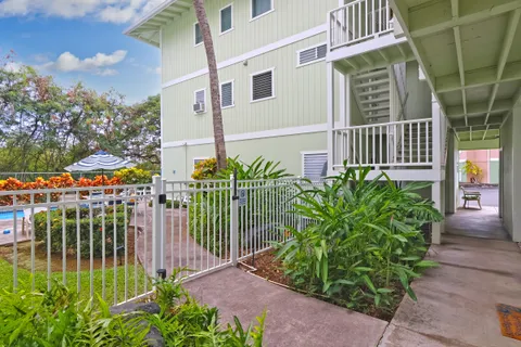 swimming pool view with a seating space