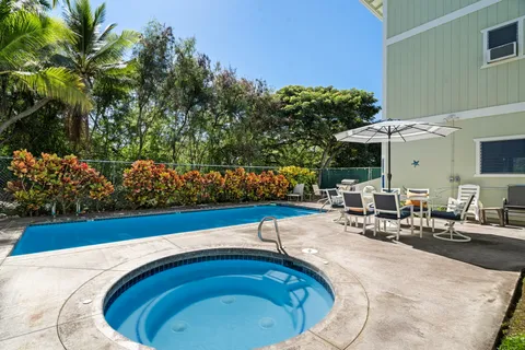 a view of staircase with wooden floor and a rug