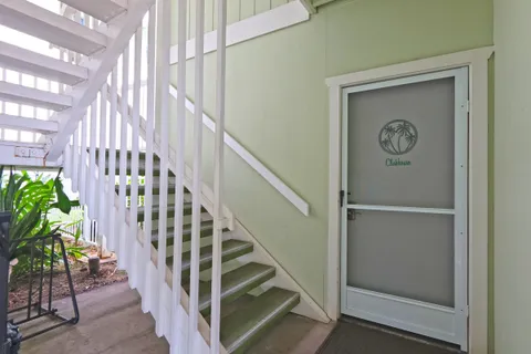 a dining room with furniture a chandelier and window