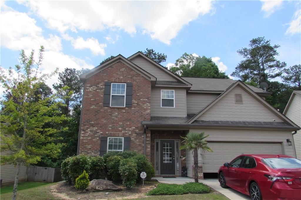 5536 Valley Loop Fairburn, GA 30213 - Photo 1 of 1 a front view of a house with garden