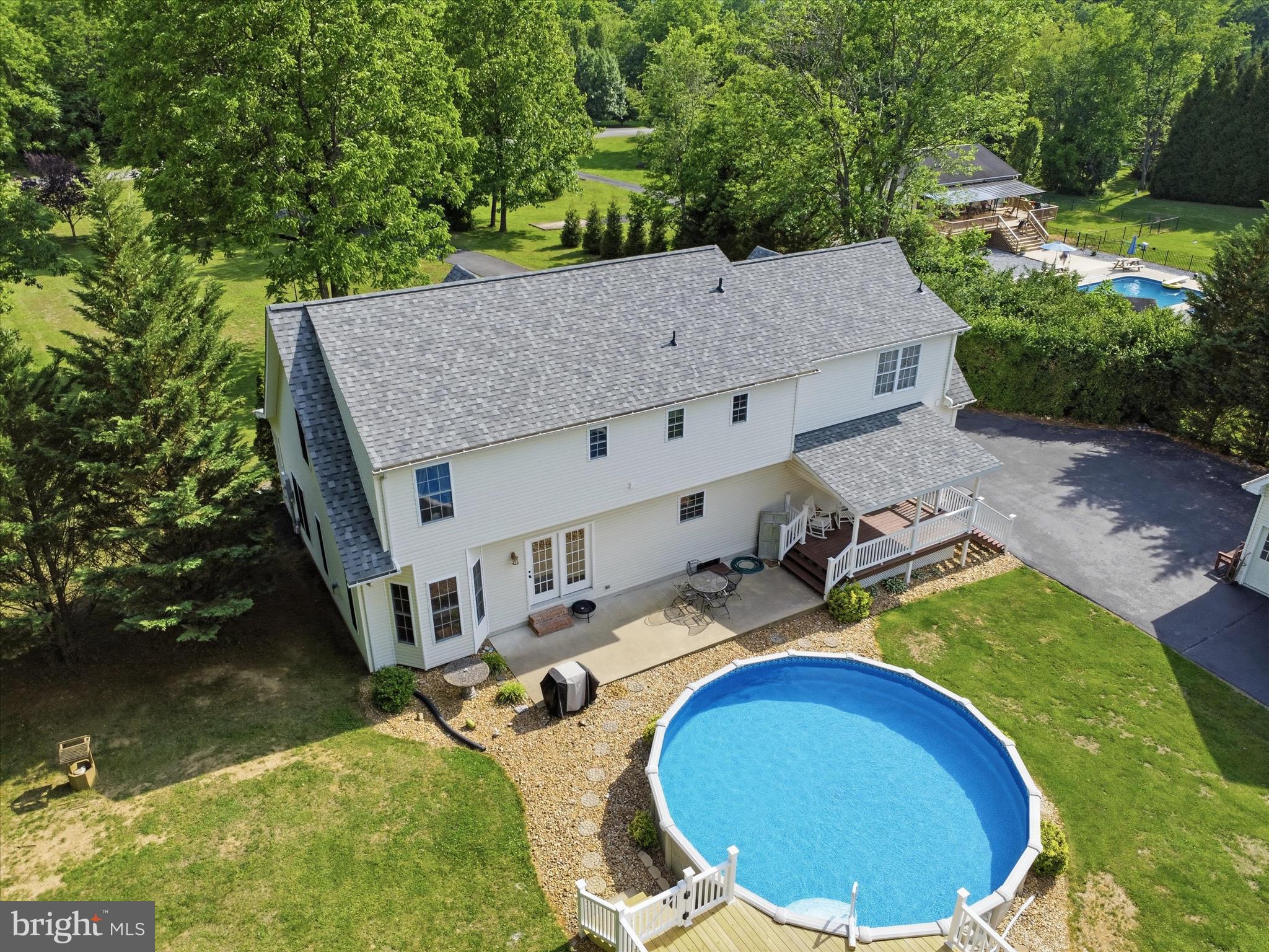 726 Doe Run Road Inwood, WV 25428 - Photo 10 of 68 an aerial view of a house with swimming pool and patio