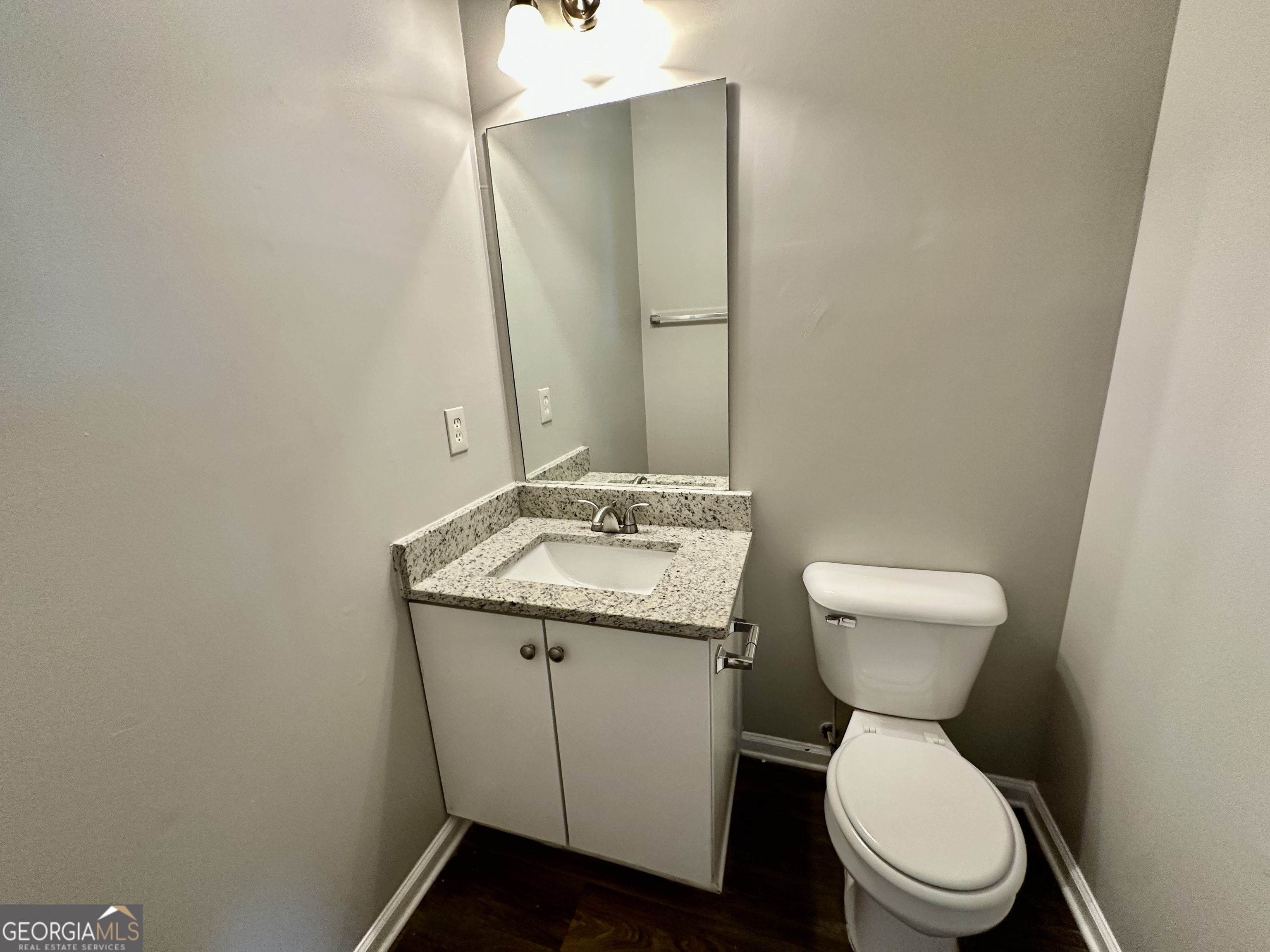 3763 Waldrop Hills Drive Decatur, GA 30034 - Photo 16 of 31 a bathroom with a granite countertop toilet and a sink