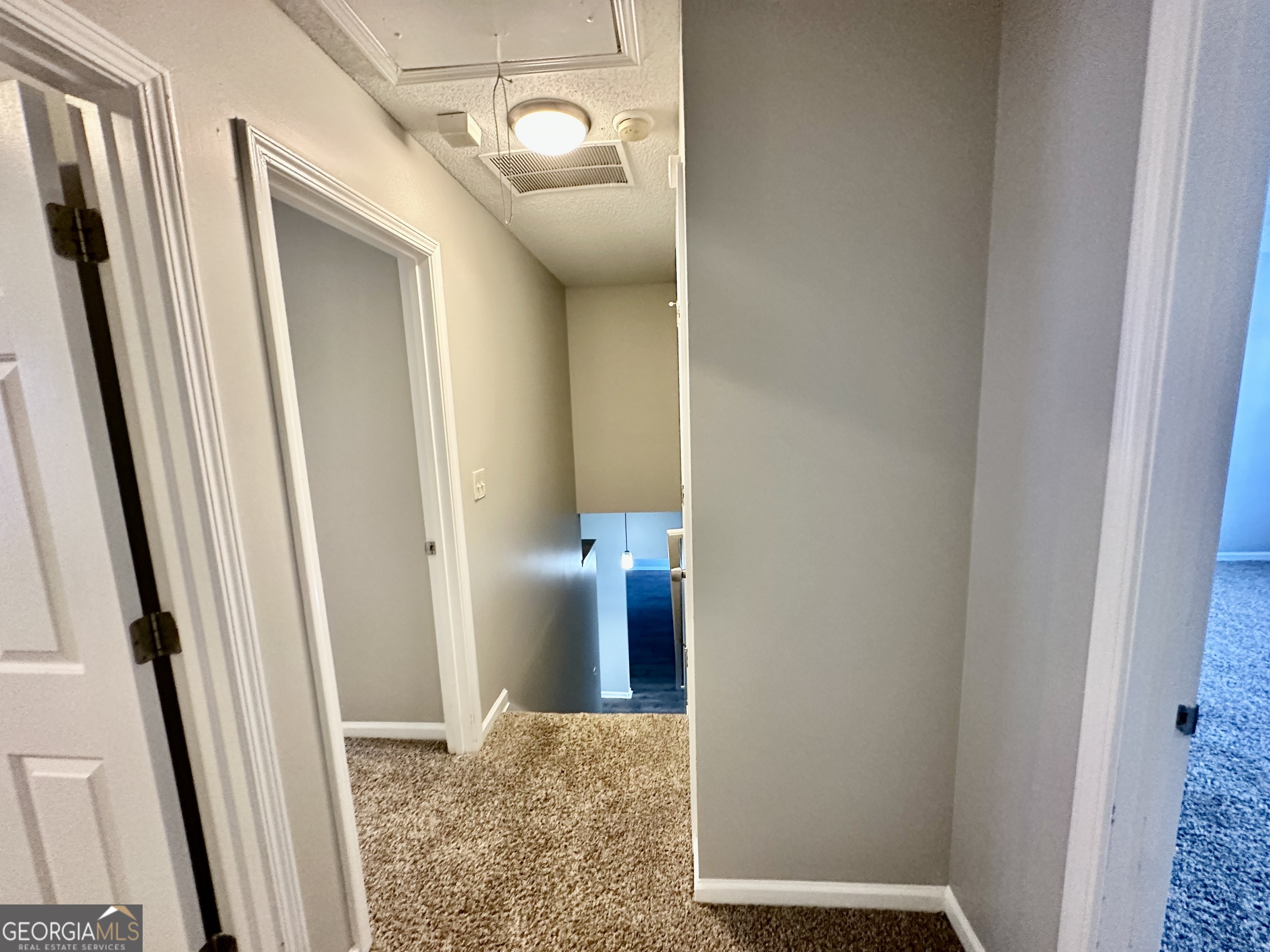 3763 Waldrop Hills Drive Decatur, GA 30034 - Photo 17 of 31 a view of a hallway with wooden floor and a bathroom