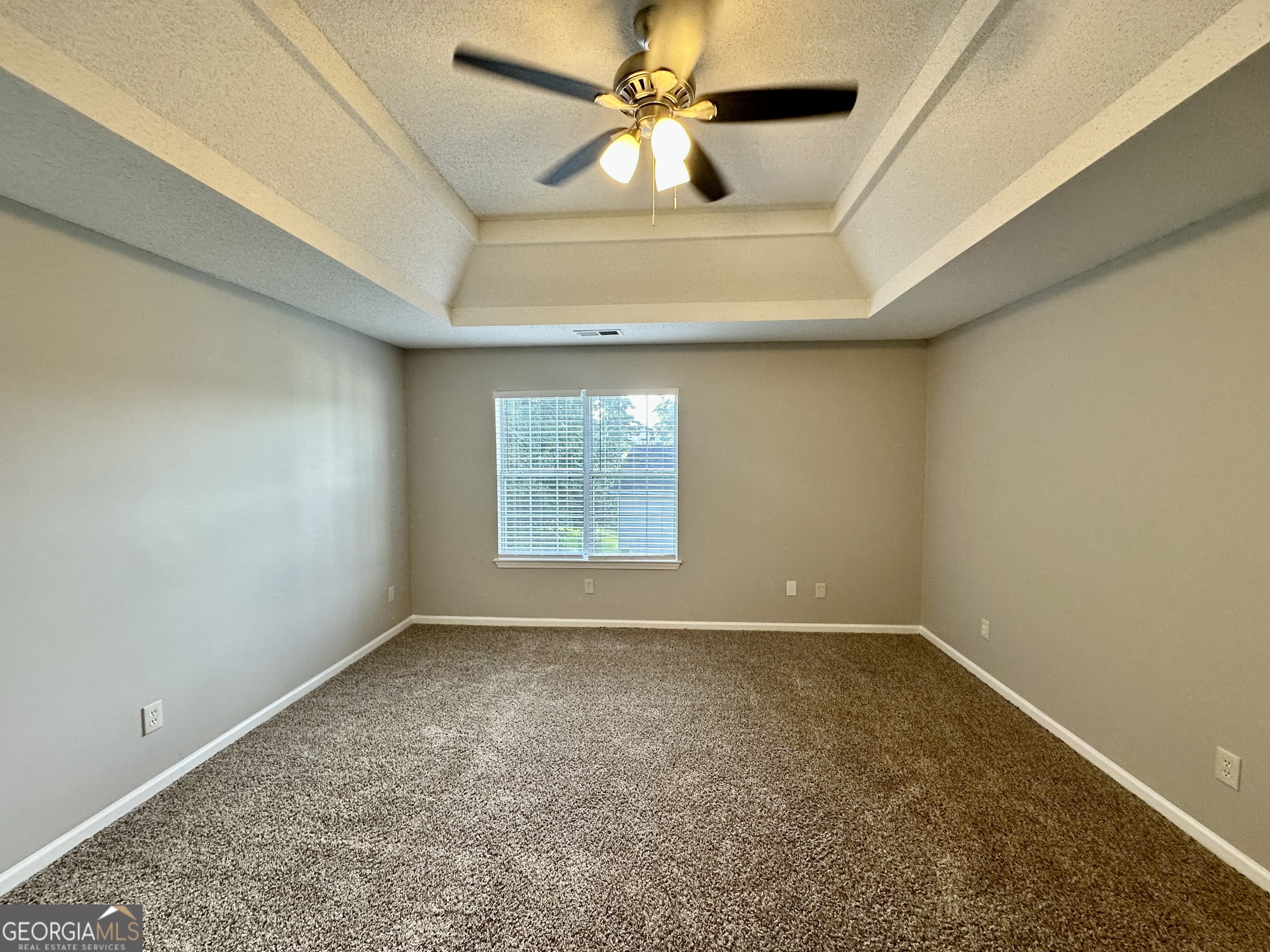 3763 Waldrop Hills Drive Decatur, GA 30034 - Photo 20 of 31 an empty room with windows and fan