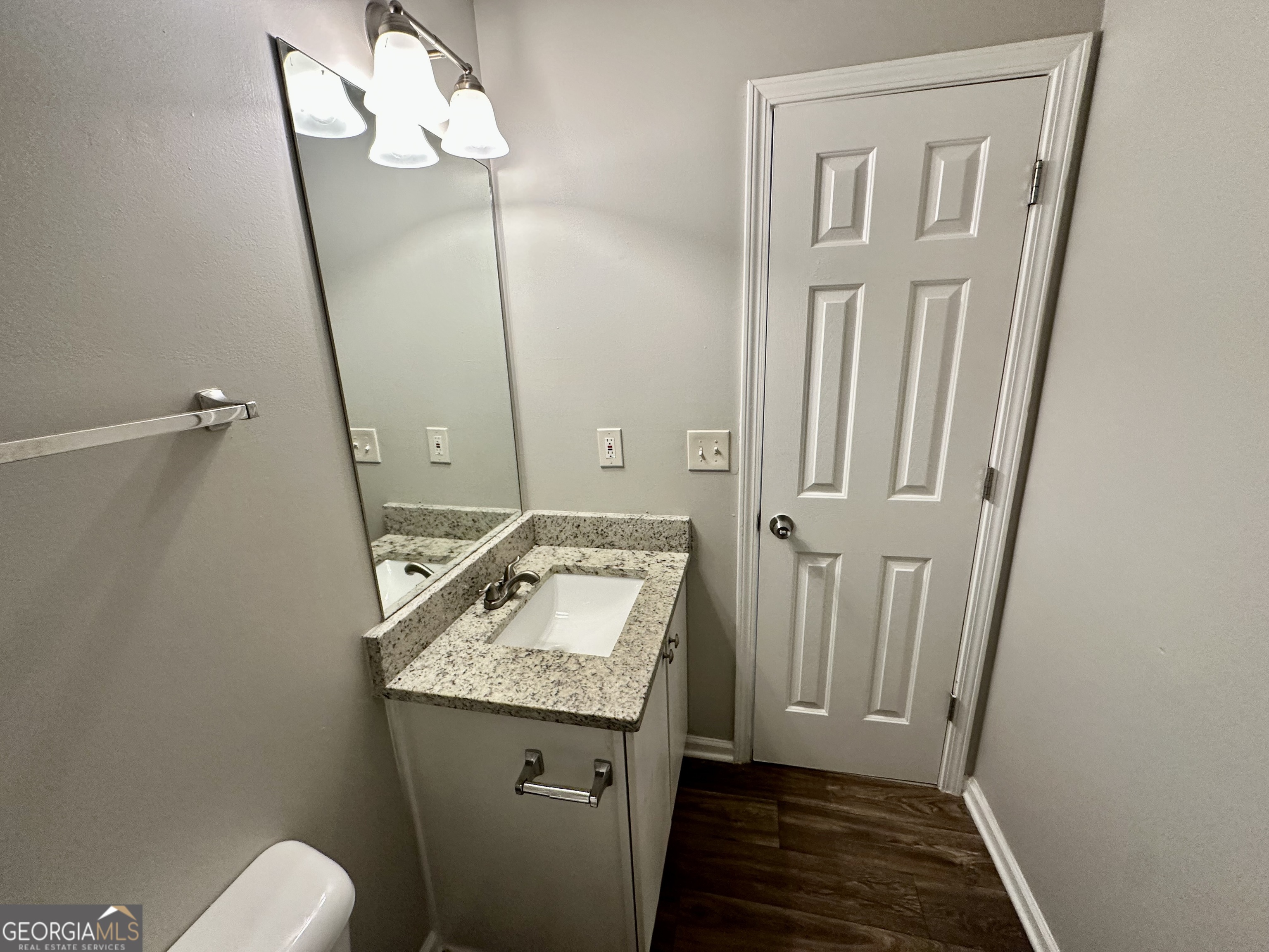 3763 Waldrop Hills Drive Decatur, GA 30034 - Photo 25 of 31 a bathroom with a granite countertop sink and a mirror