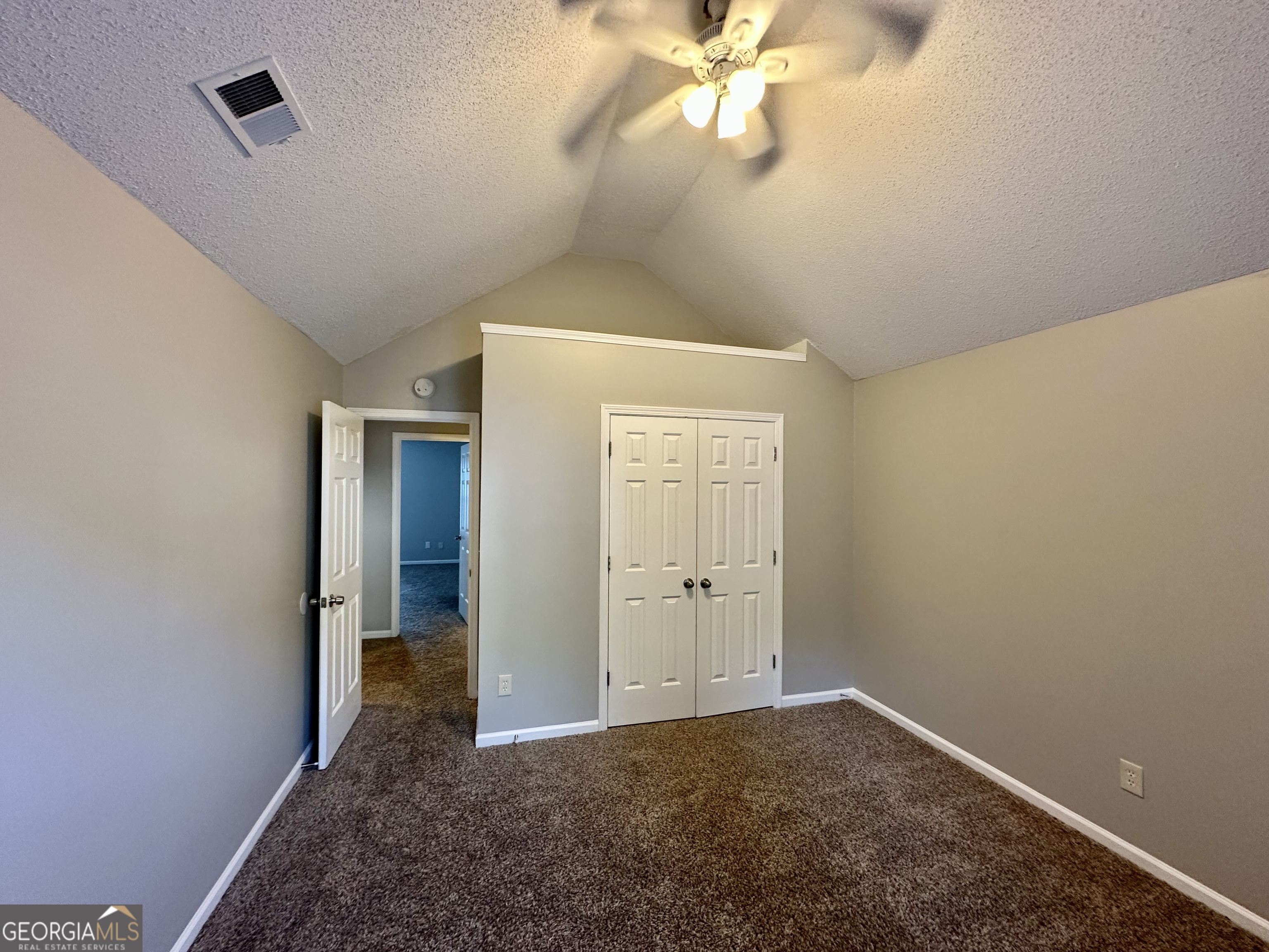 3763 Waldrop Hills Drive Decatur, GA 30034 - Photo 27 of 31 an empty room with windows and fan