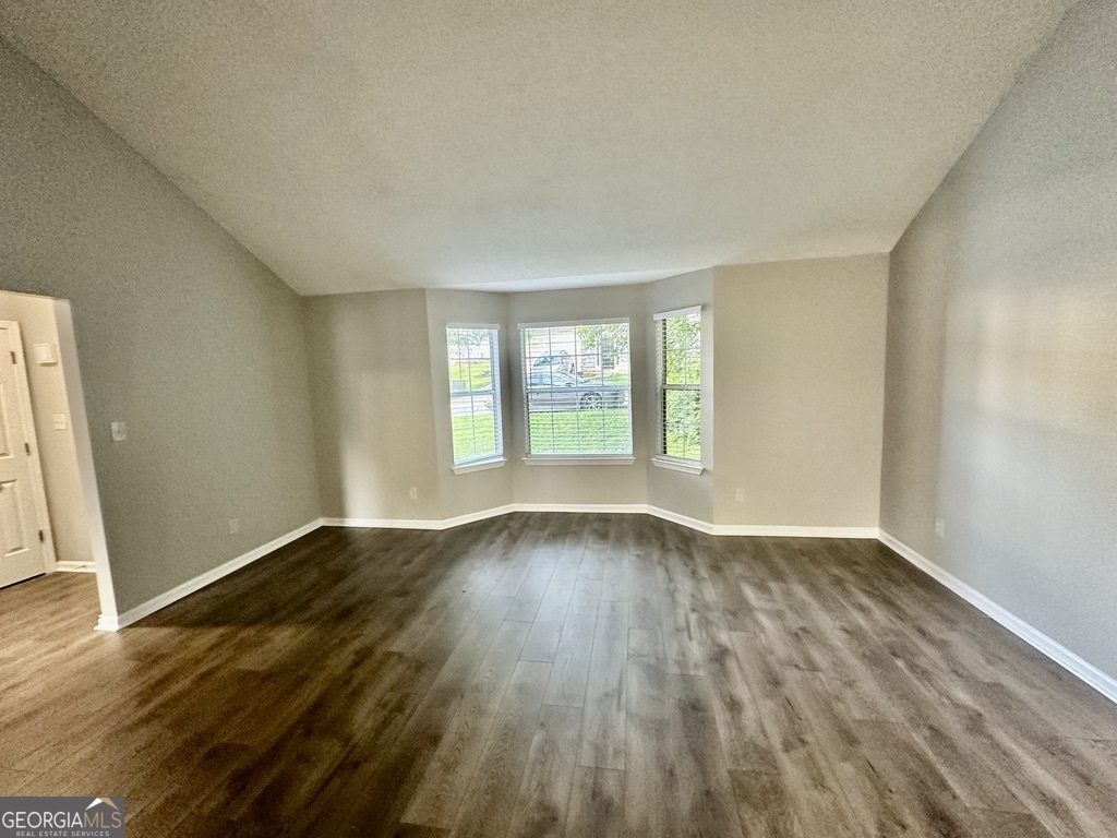 3763 Waldrop Hills Drive Decatur, GA 30034 - Photo 6 of 31 an empty room with wooden floor and windows