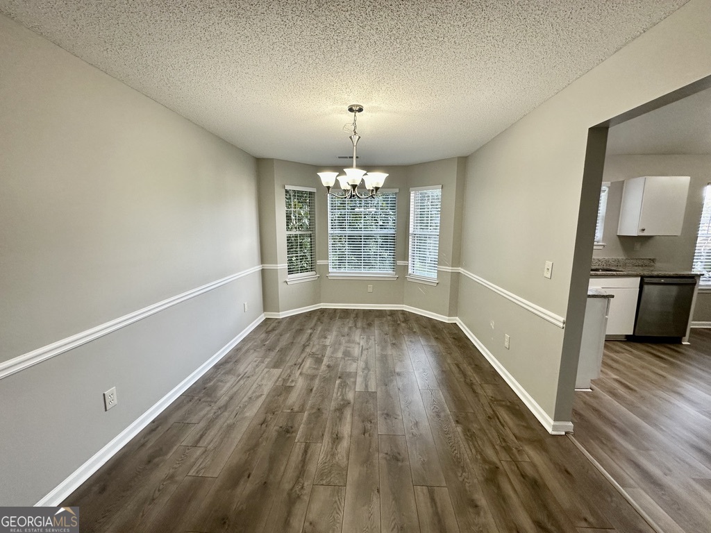 3763 Waldrop Hills Drive Decatur, GA 30034 - Photo 10 of 31 wooden floor in an empty room with a window
