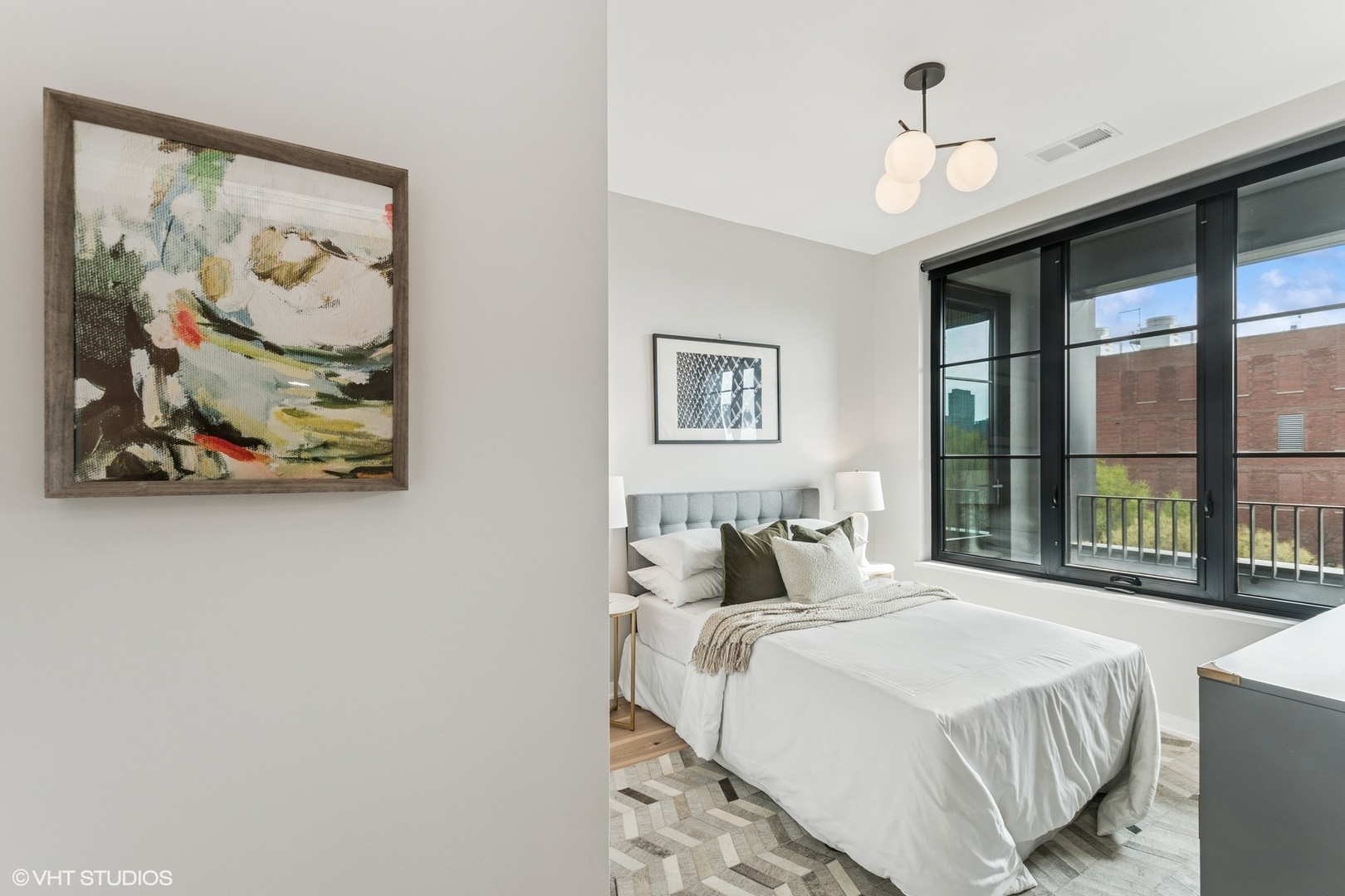 1400 West Monroe Street, Unit 4F Chicago, IL 60607 - Photo 17 of 22 a bedroom with a bed and a painting on the wall