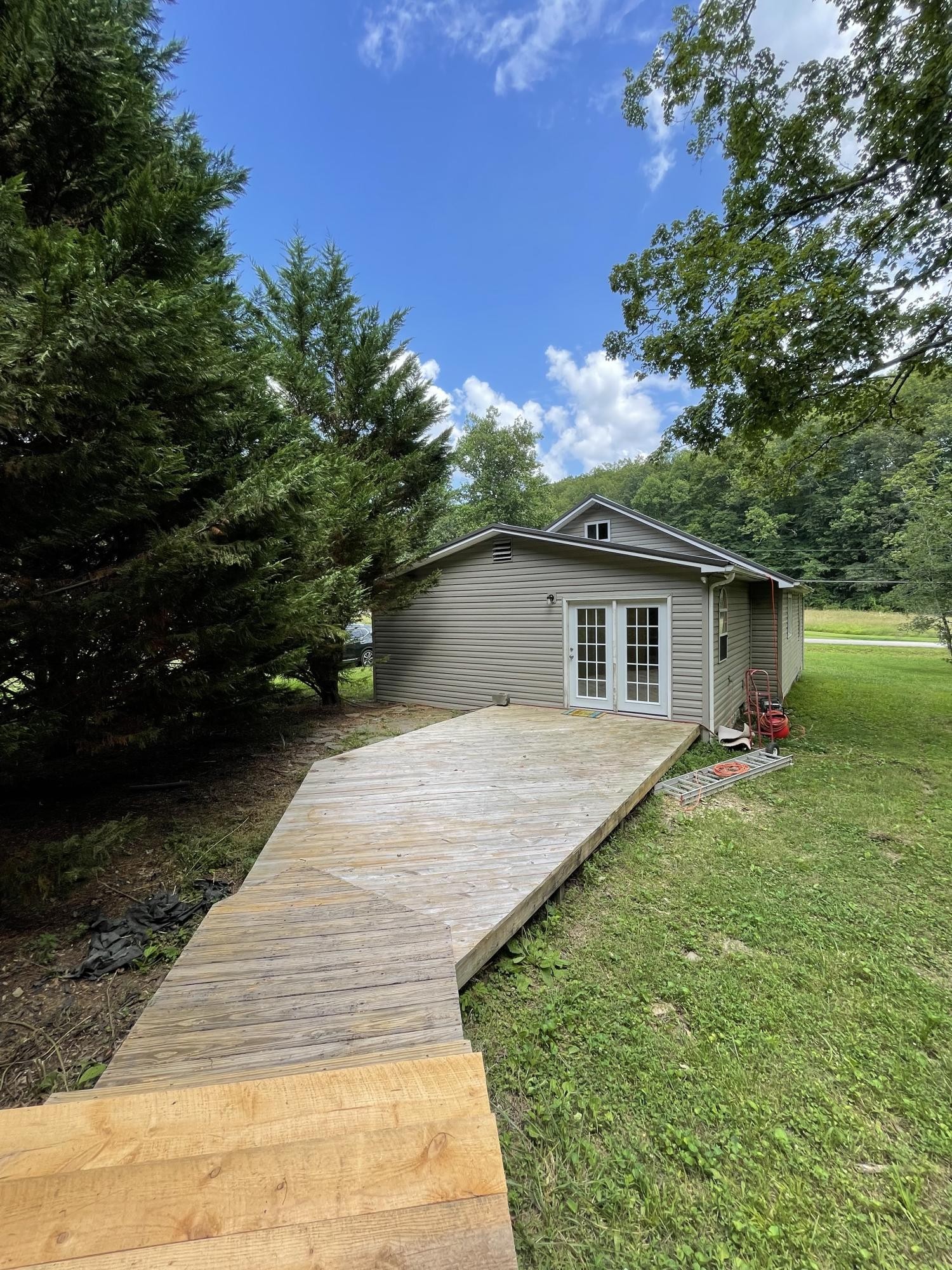 474 Pumpkin Hollow Road Heiskell, TN 37754 - Photo 20 of 22 a front view of house with yard and trees