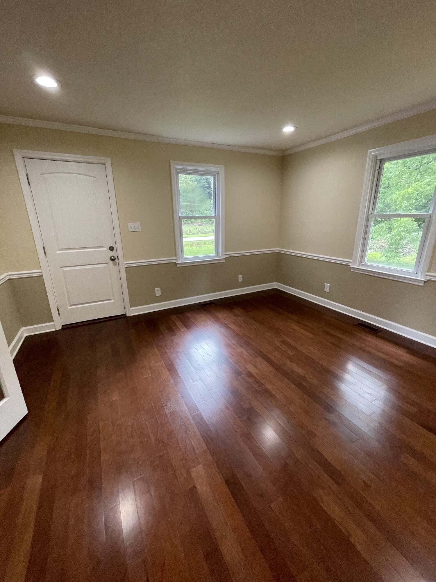 474 Pumpkin Hollow Road Heiskell, TN 37754 - Photo 5 of 22 an empty room with wooden floor and windows