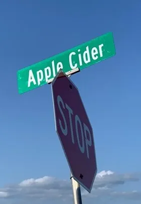 a bathroom with a shower and a signage