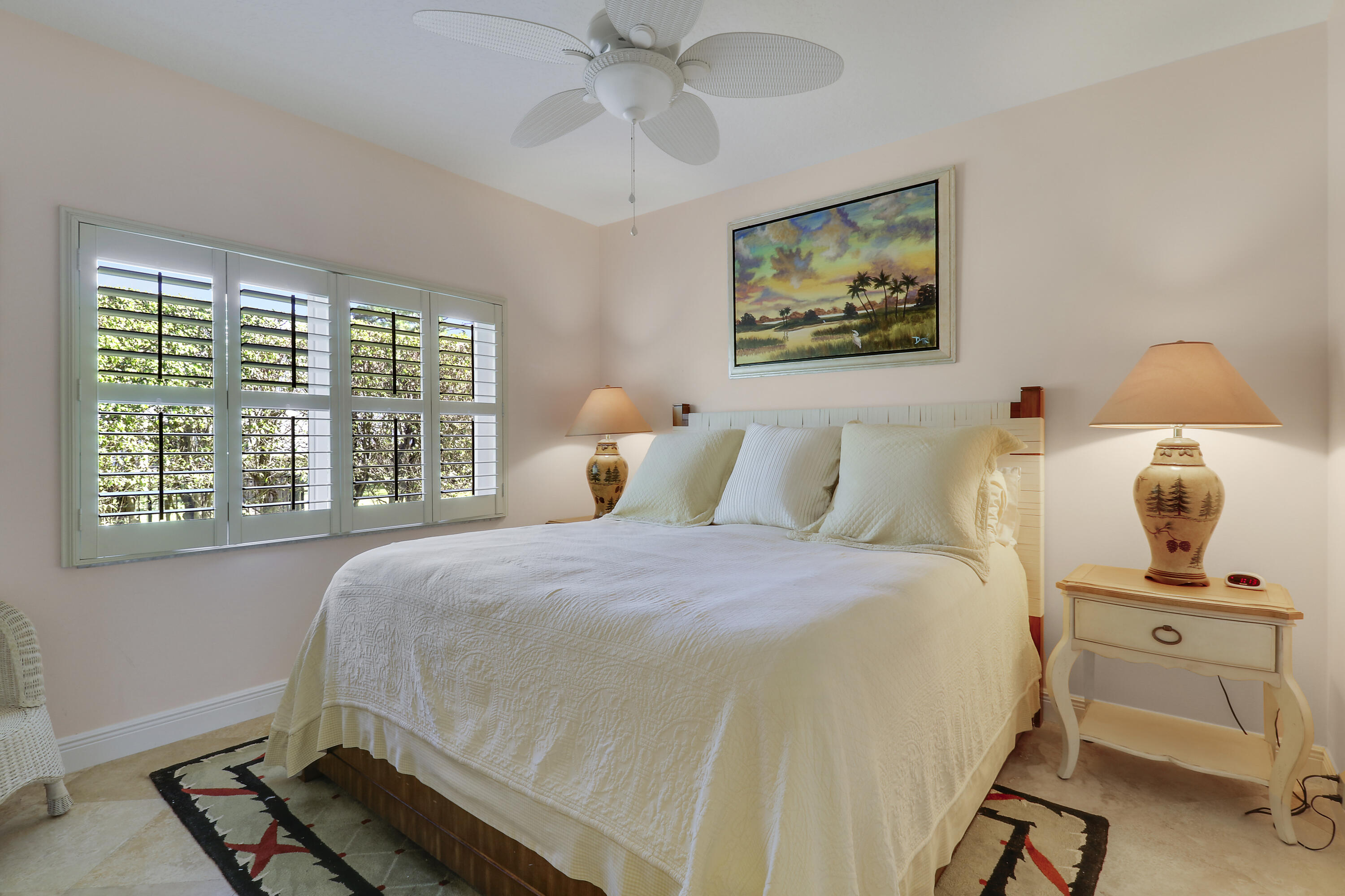 5213 Desert Vixen Road Palm Beach Gardens, FL 33418 - Photo 20 of 28 a bedroom with a bed and wooden floor