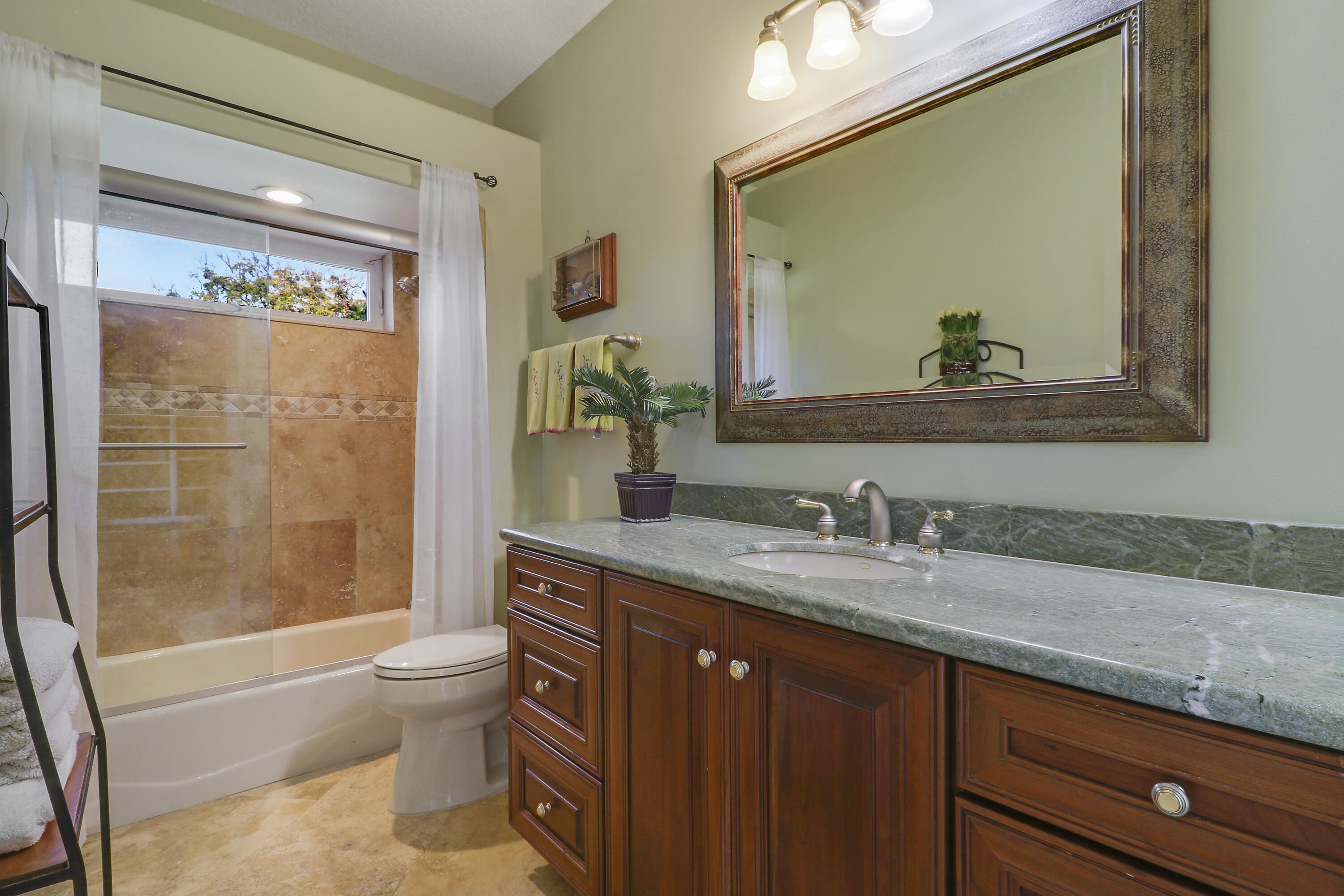 5213 Desert Vixen Road Palm Beach Gardens, FL 33418 - Photo 21 of 28 a bathroom with a granite countertop sink mirror vanity and toilet