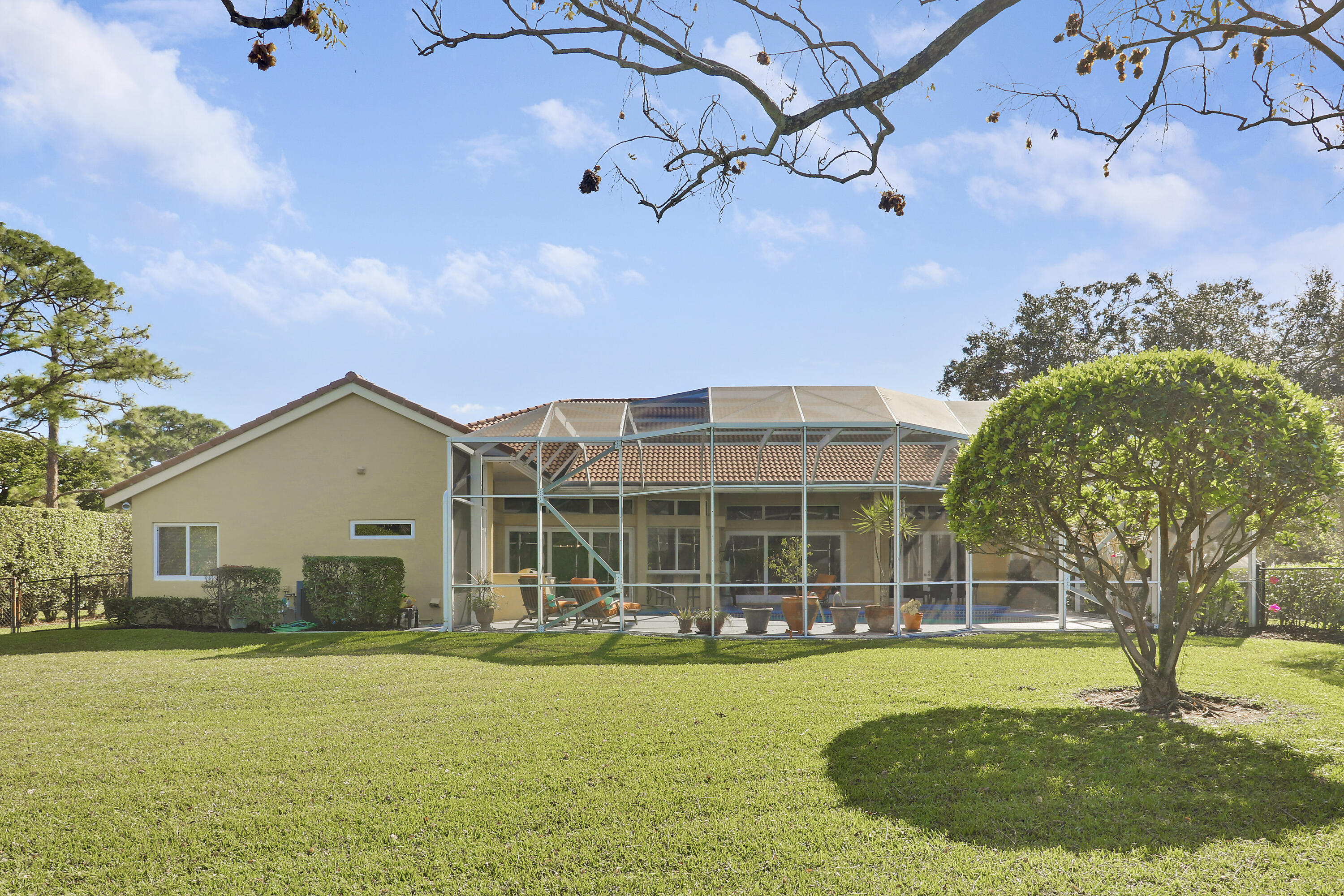 5213 Desert Vixen Road Palm Beach Gardens, FL 33418 - Photo 27 of 28 a front view of a house with a yard