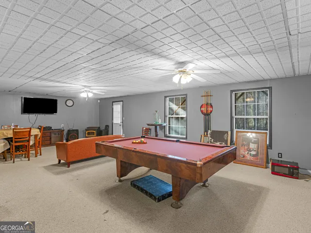 a swimming pool with chairs