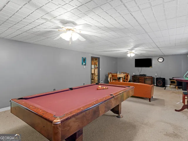 a room with furniture and flat screen tv