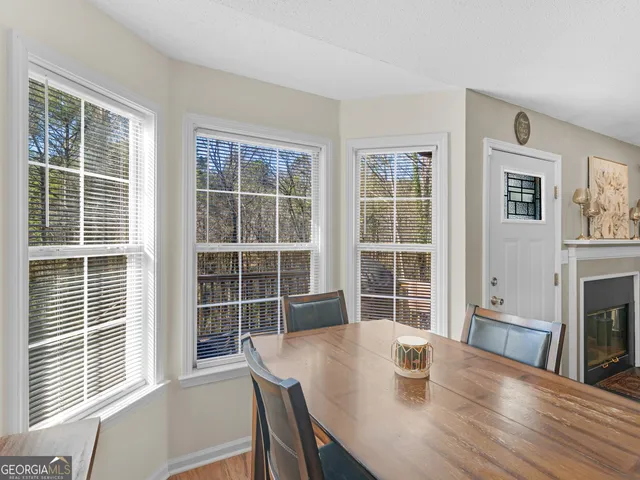 a view of a dining room with furniture window and wooden floor