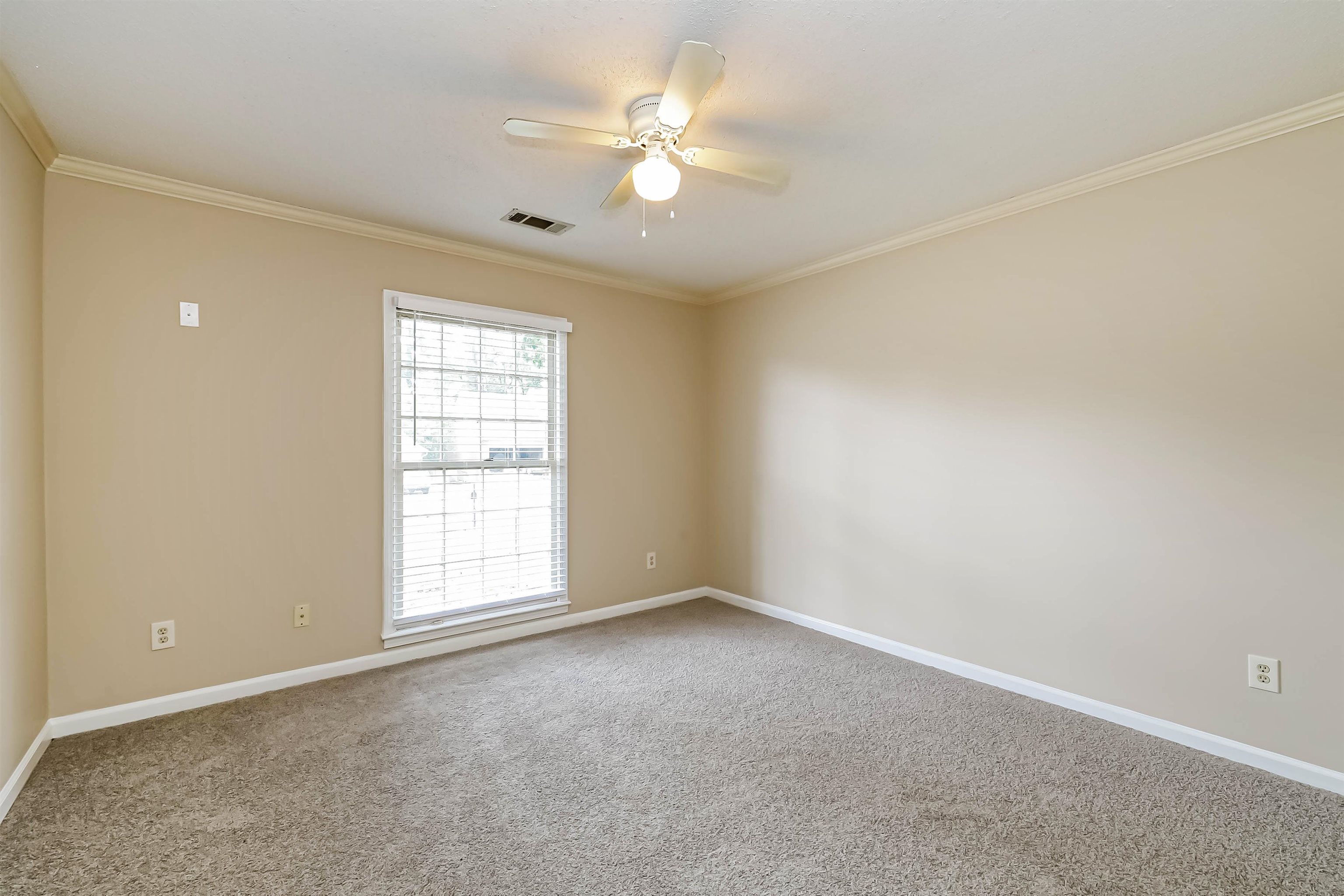 432 Leaf Trail Lane Memphis, TN 38018 - Photo 14 of 17 Carpeted empty room with crown molding and ceiling fan