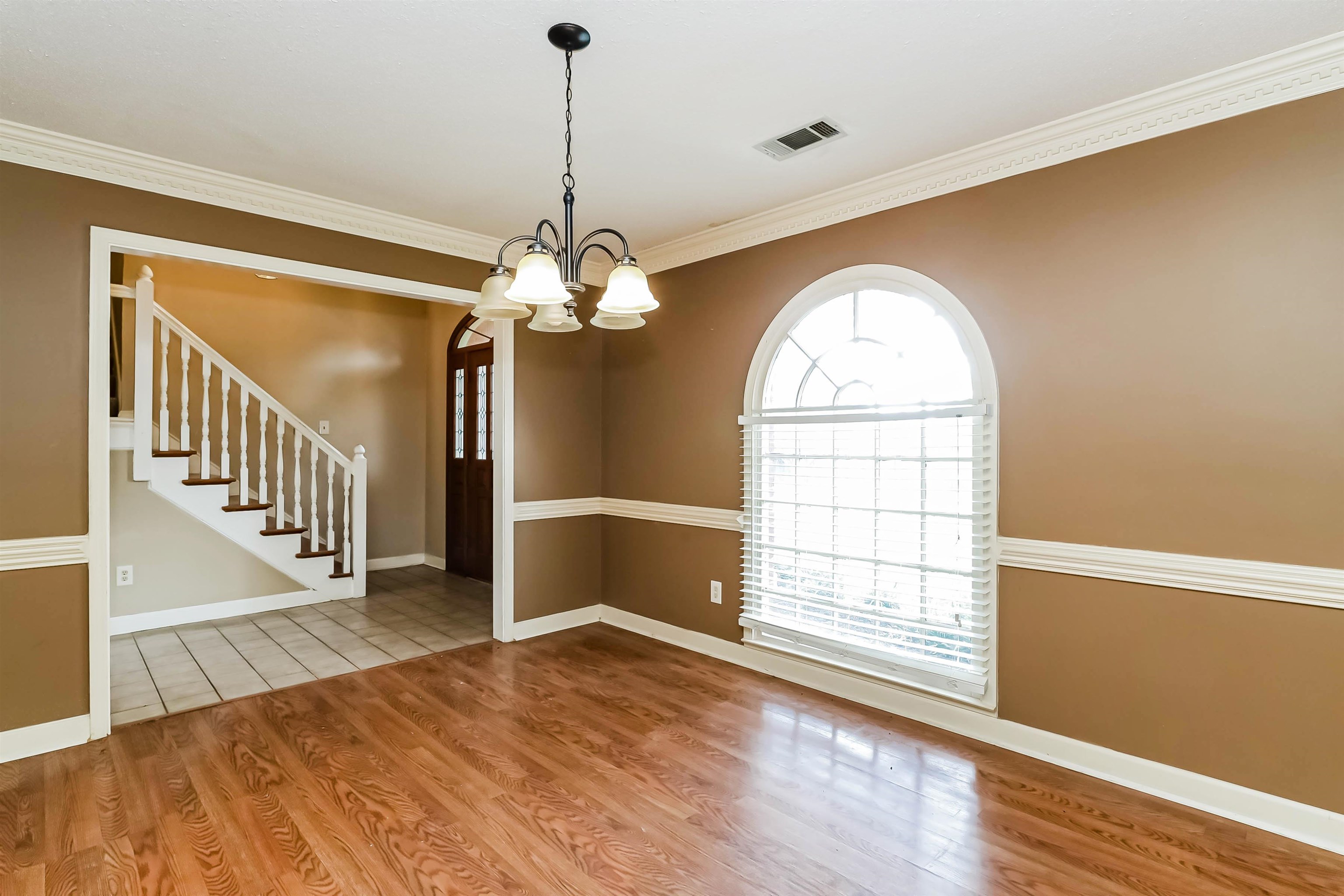 432 Leaf Trail Lane Memphis, TN 38018 - Photo 5 of 17 Tiled empty room with ornamental molding and a chandelier