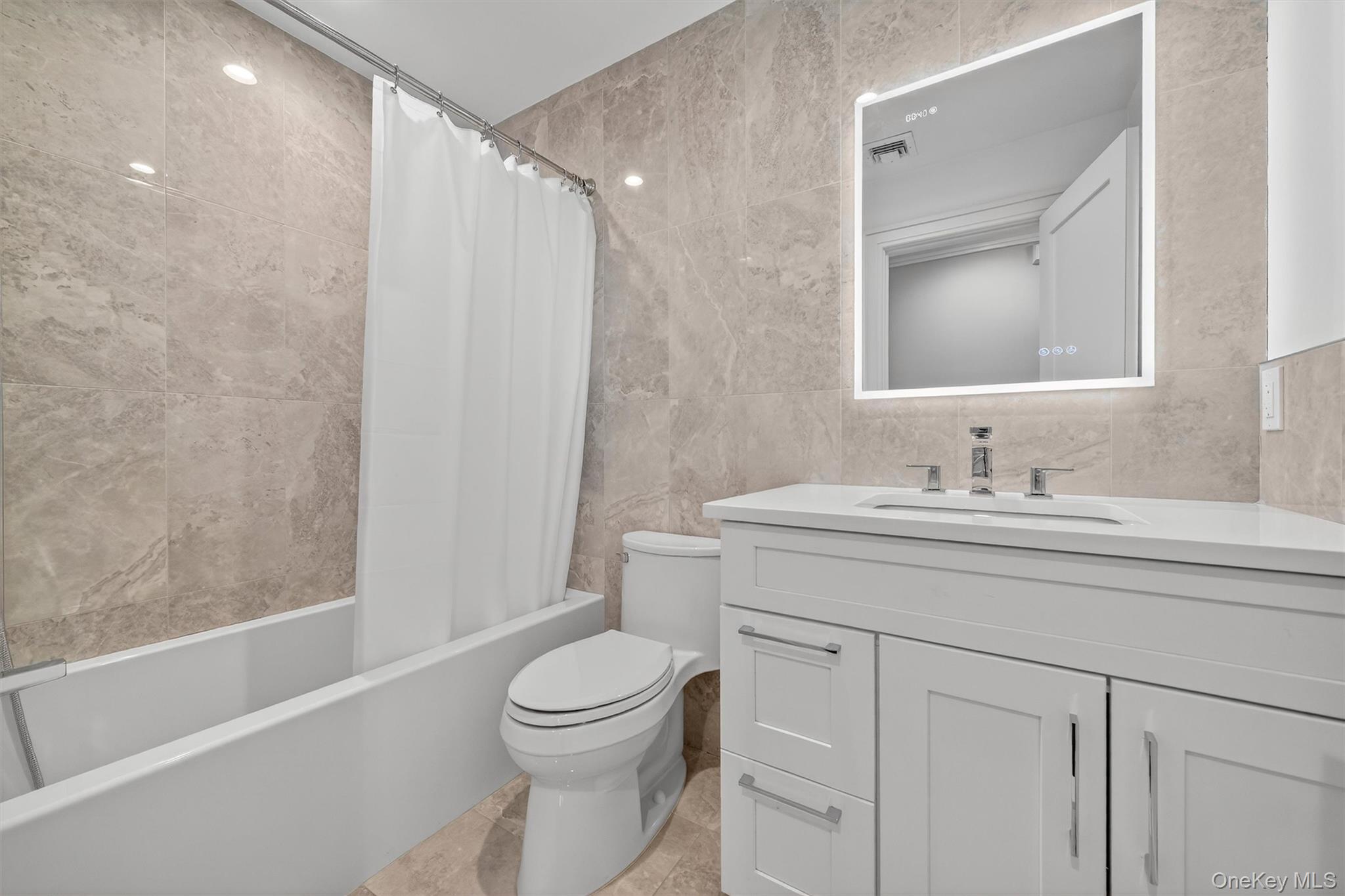 200 South Bedford Road Chappaqua, NY 10514 - Photo 17 of 38 a bathroom with a sink a toilet and shower