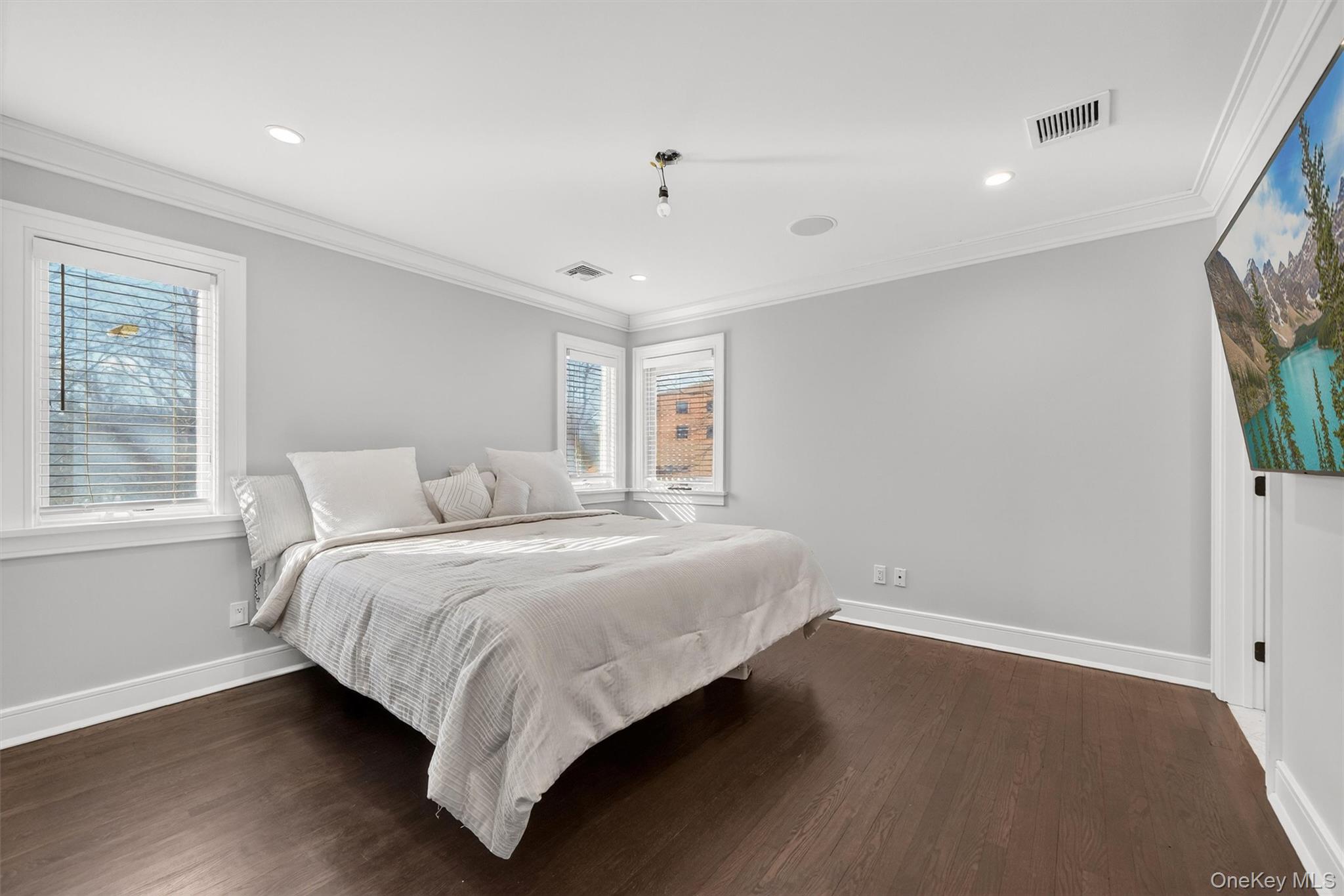 200 South Bedford Road Chappaqua, NY 10514 - Photo 20 of 38 a bed room with a bed and a flat screen tv