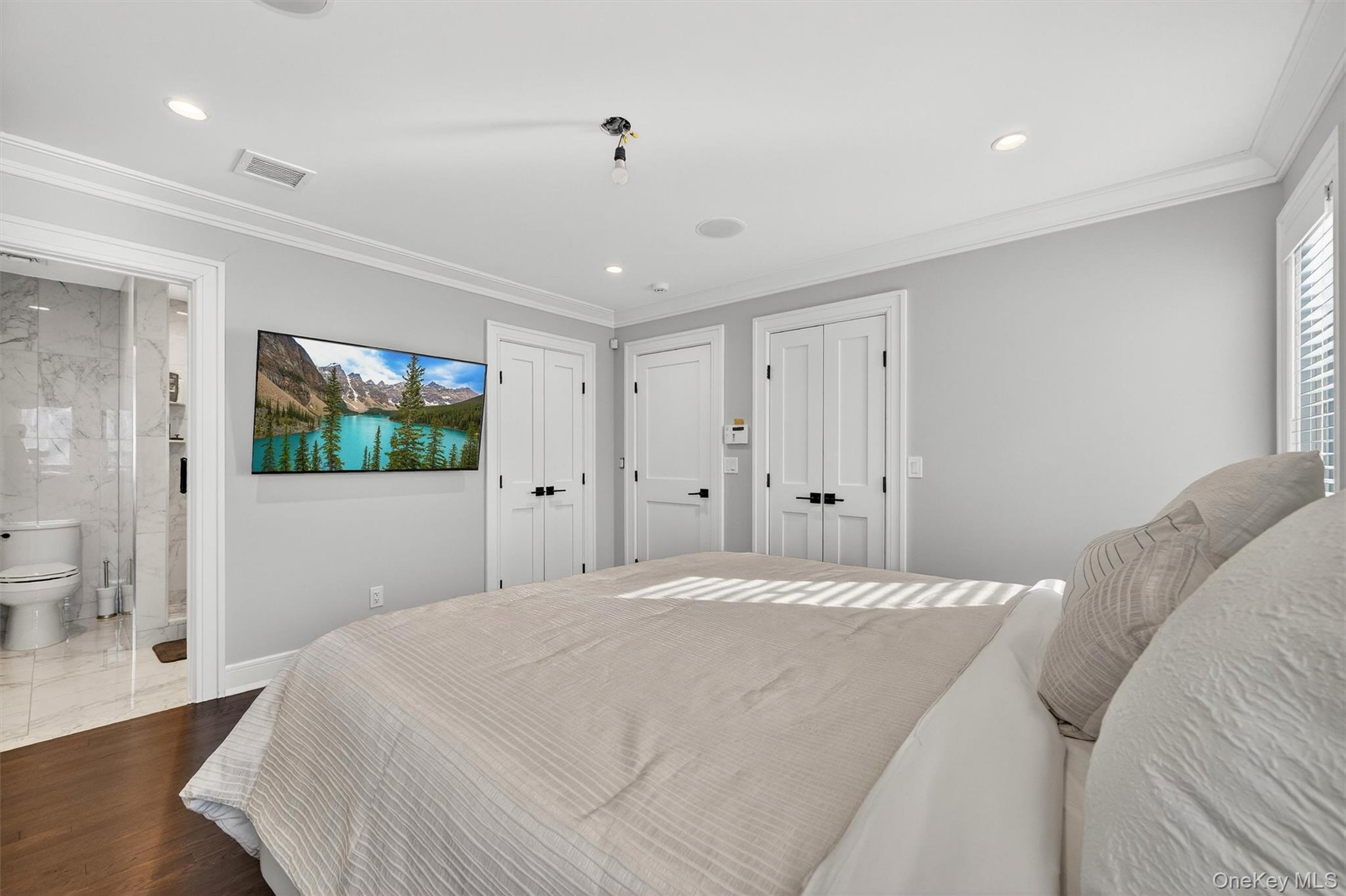 200 South Bedford Road Chappaqua, NY 10514 - Photo 21 of 38 a bedroom with a bed and a flat screen tv