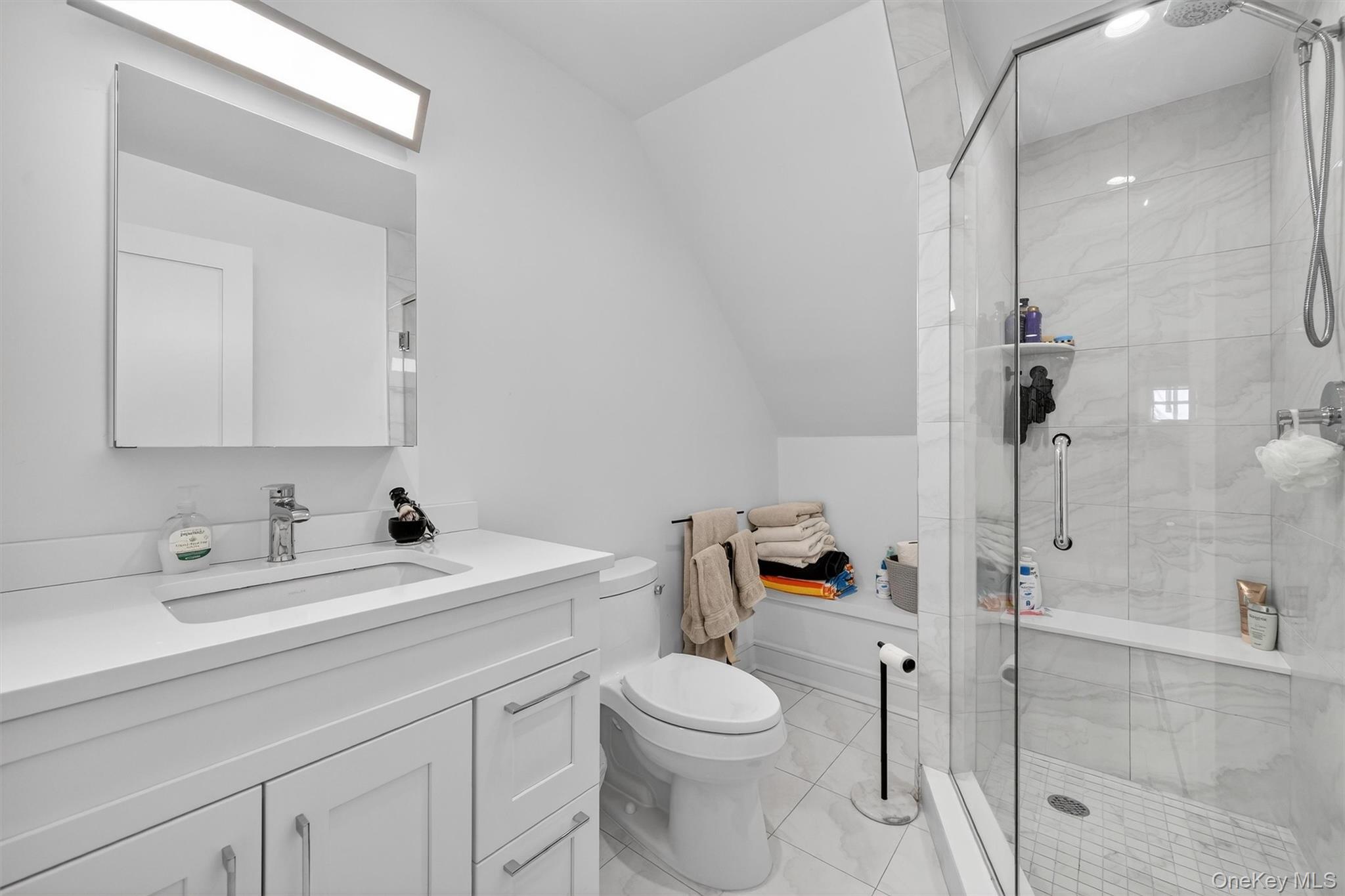 200 South Bedford Road Chappaqua, NY 10514 - Photo 24 of 38 a bathroom with a sink a toilet and shower