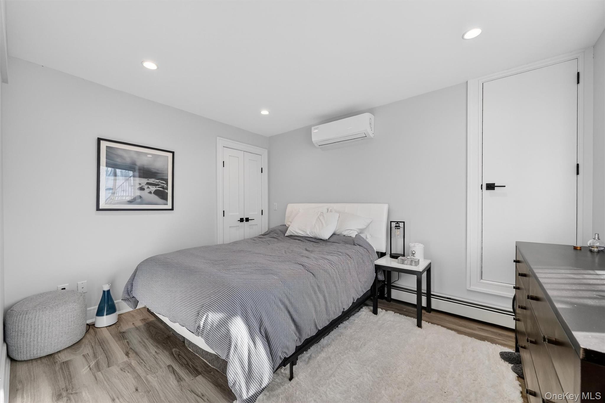 200 South Bedford Road Chappaqua, NY 10514 - Photo 27 of 38 a bedroom with a bed and wooden floor