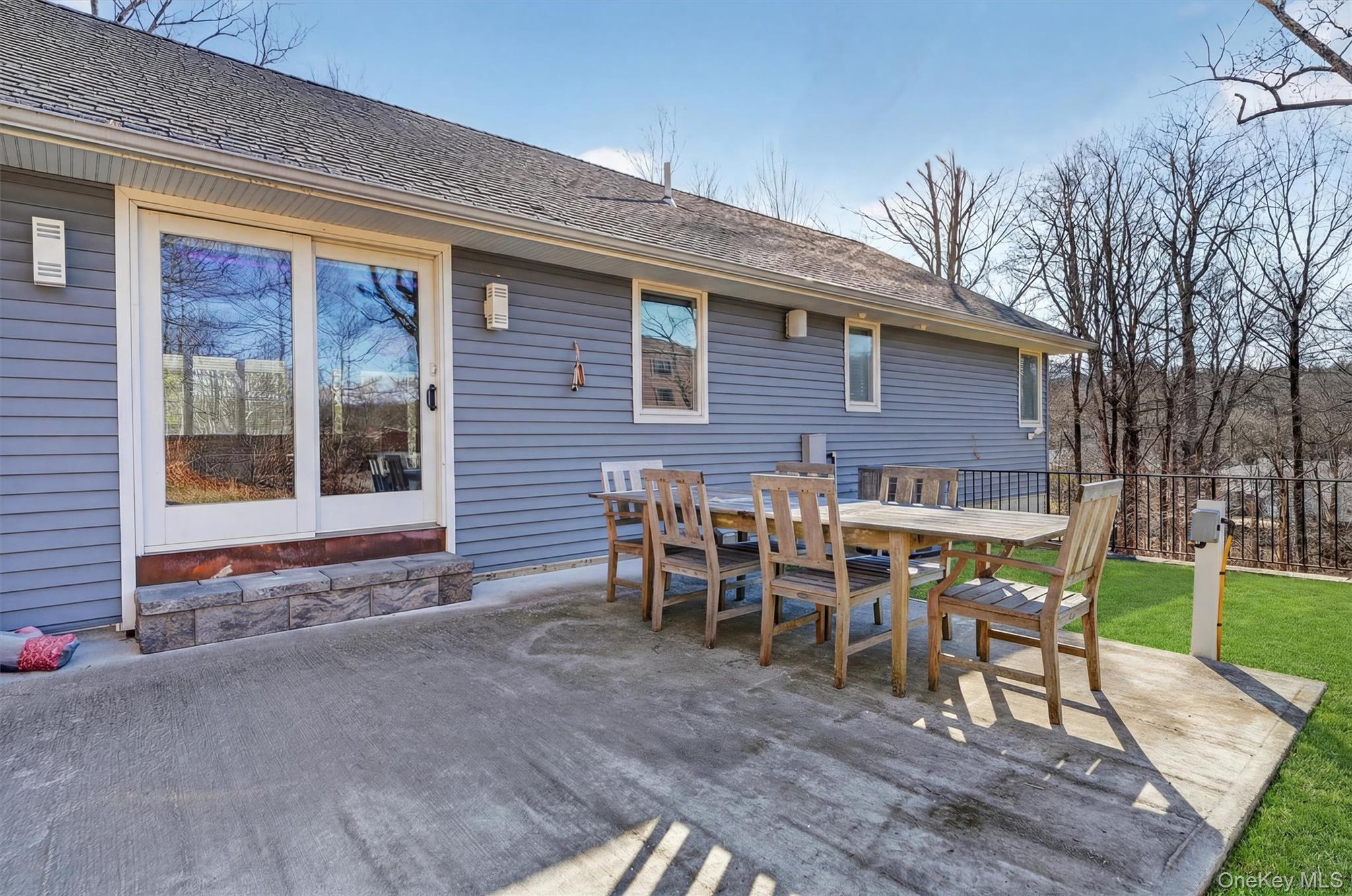 200 South Bedford Road Chappaqua, NY 10514 - Photo 29 of 38 a view of a chairs and table in backyard of the house