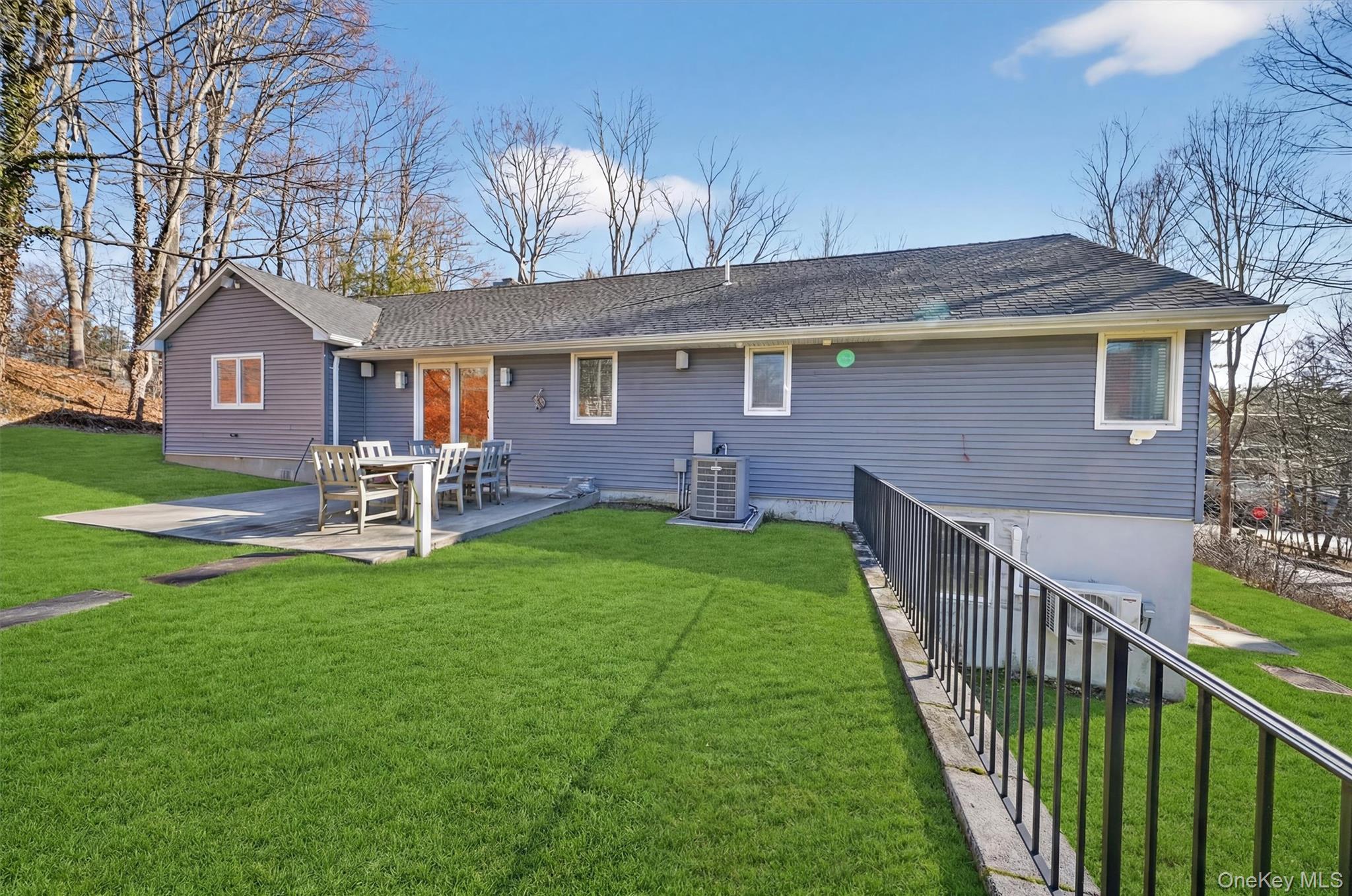 200 South Bedford Road Chappaqua, NY 10514 - Photo 32 of 38 a front view of a house with a yard table and chairs