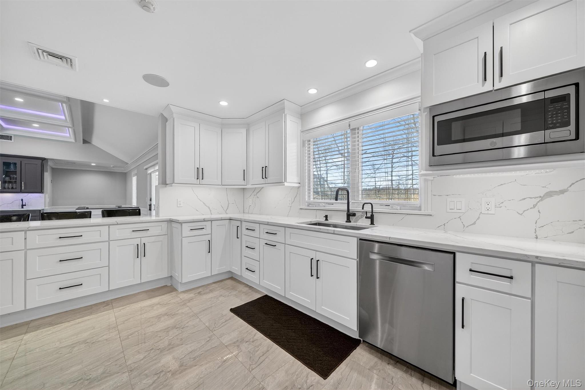 200 South Bedford Road Chappaqua, NY 10514 - Photo 4 of 38 a kitchen with granite countertop white cabinets white stainless steel appliances with a sink and dishwasher