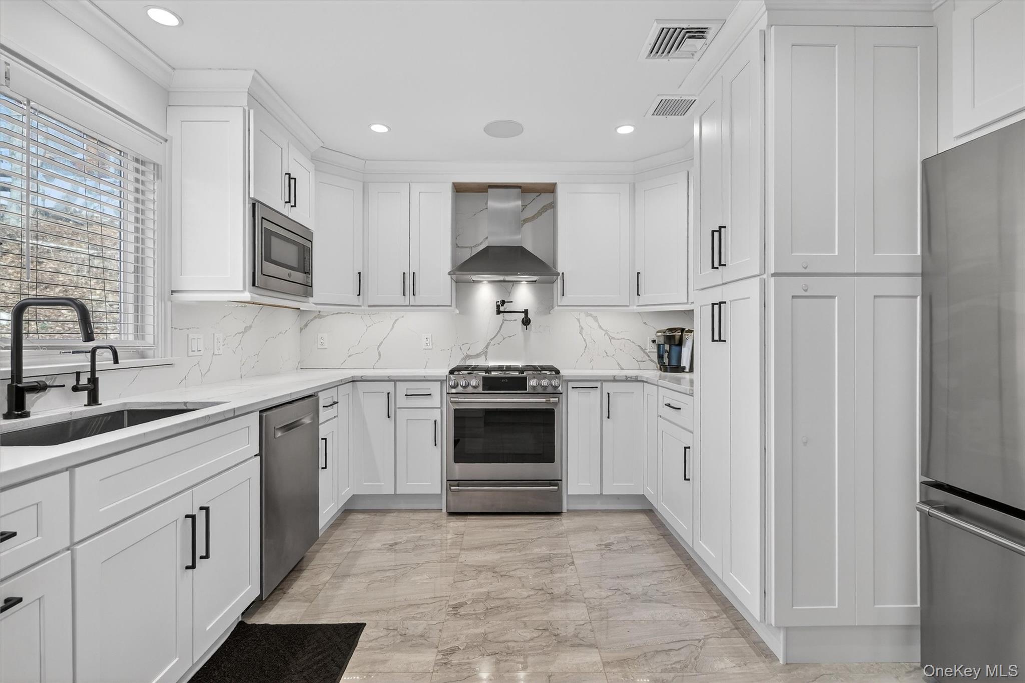 200 South Bedford Road Chappaqua, NY 10514 - Photo 5 of 38 a kitchen with a stove top oven and cabinets